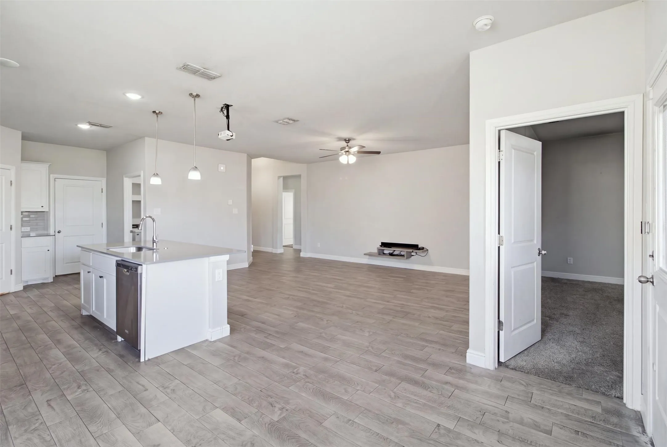 Spacious open-concept layout with wood-finish flooring