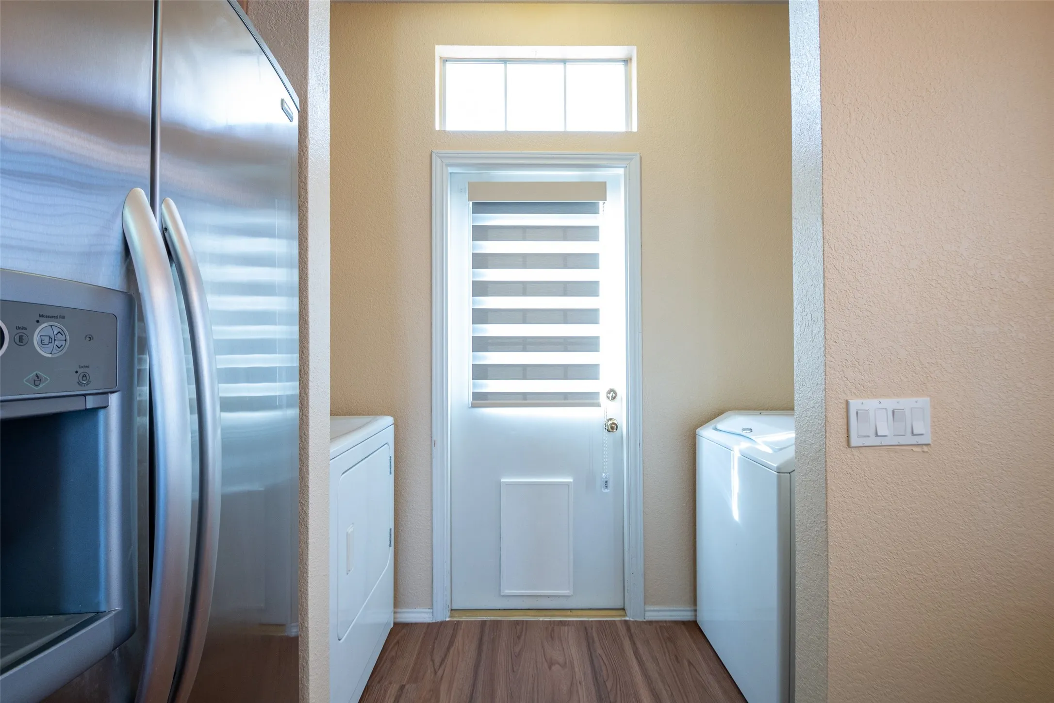 Wood-finish flooring with a light-colored wall finish