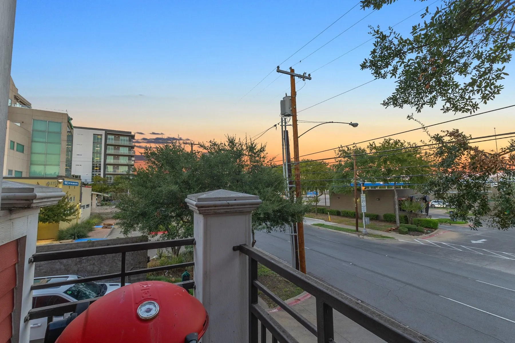 Private balcony with room for grilling and views of the Uptown streetscape