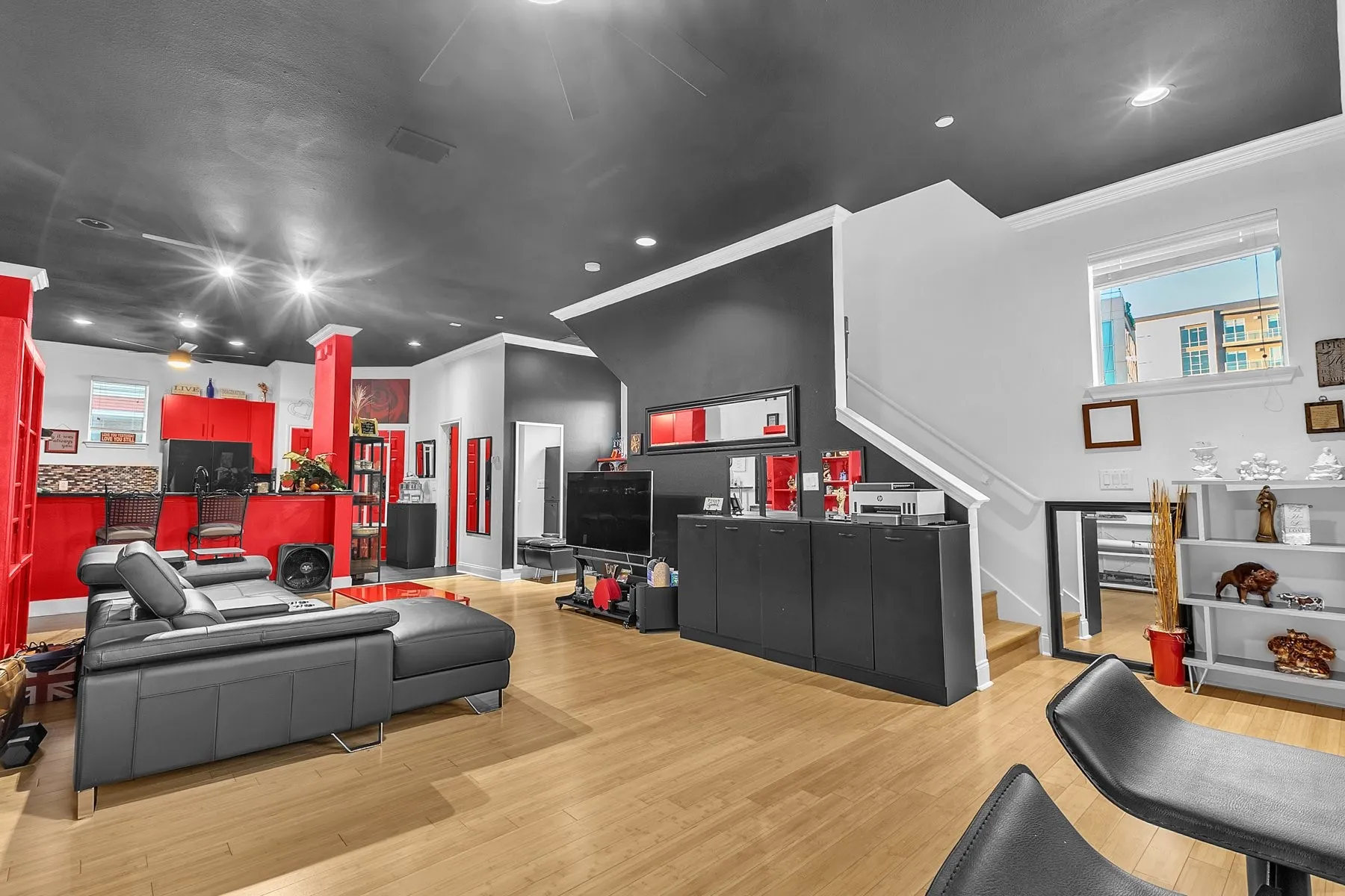 Living area with staircase access and an abundance of natural light