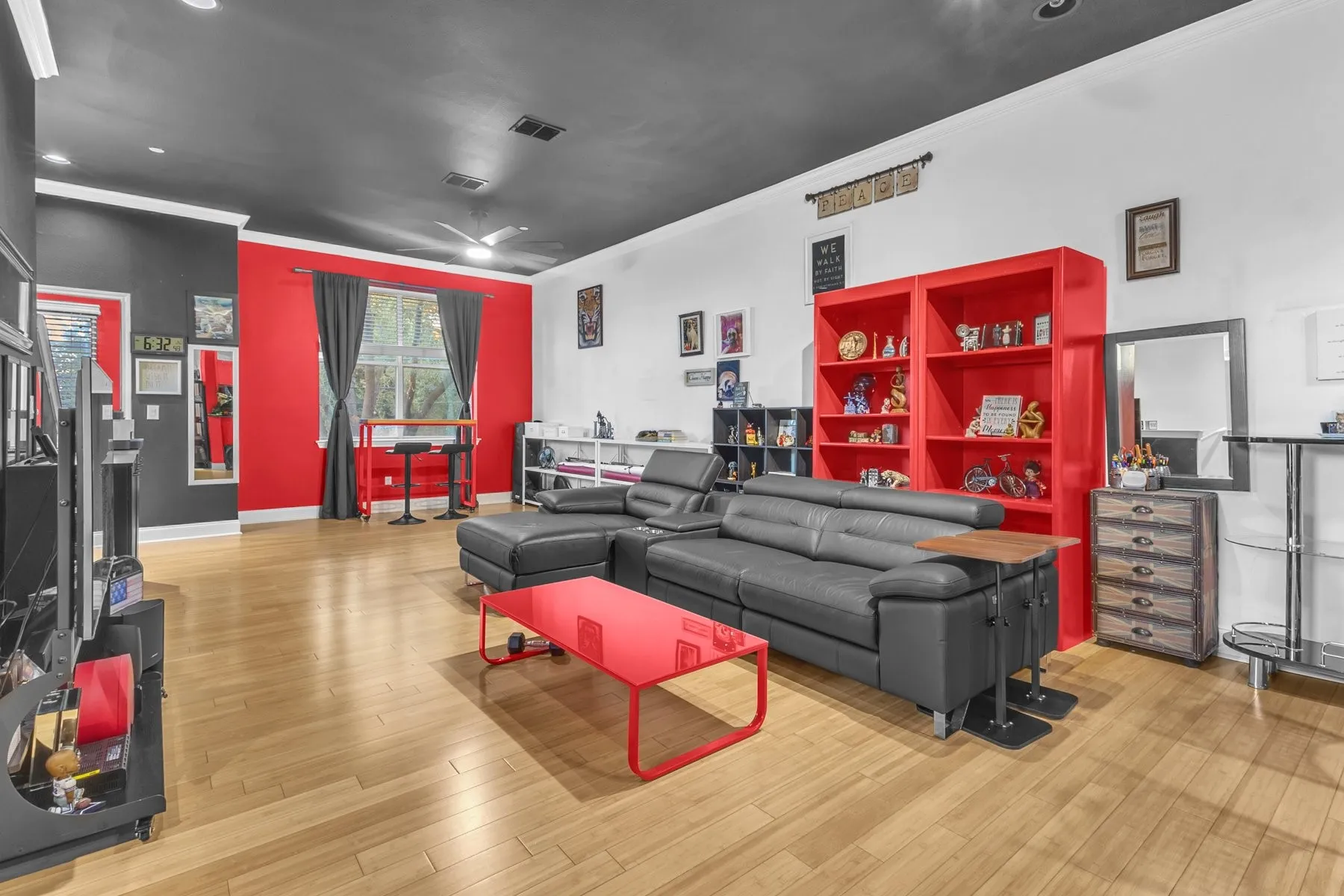 Living room with engineered wood floors flowing toward the front windows
