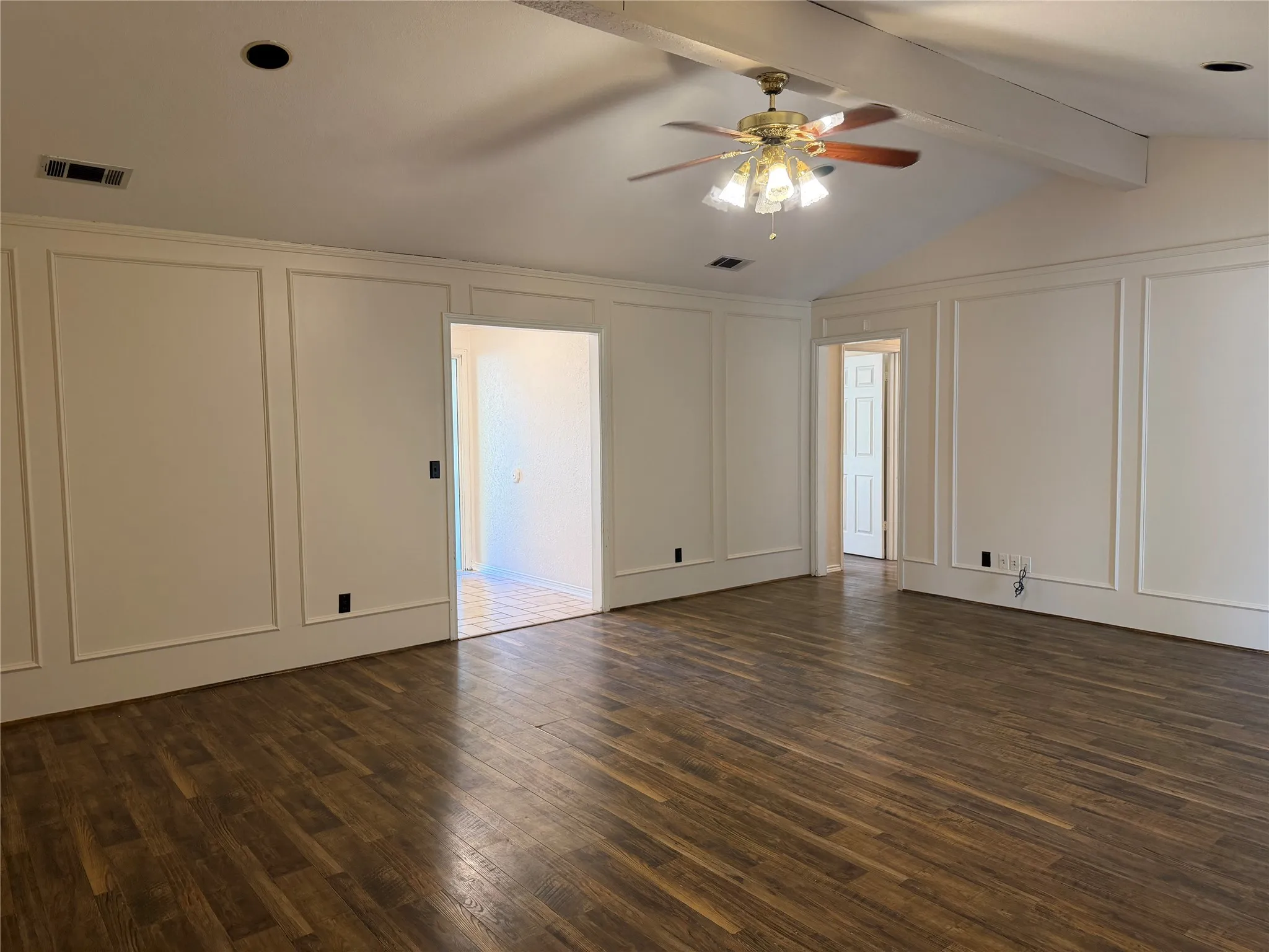 Wood-finish flooring throughout, recessed lighting, and a ceiling fan with light fixture