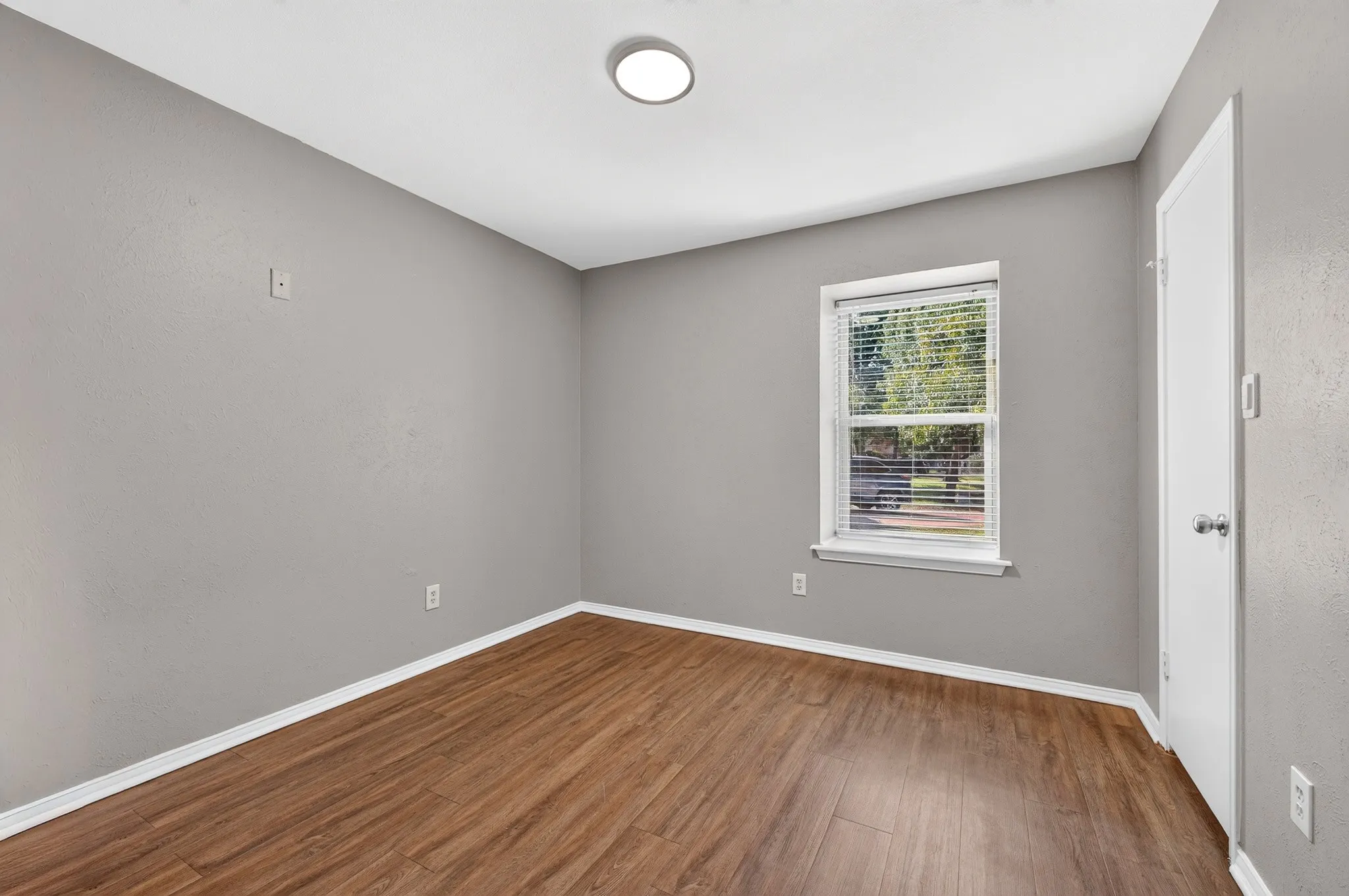 Wood-finish flooring with white trim