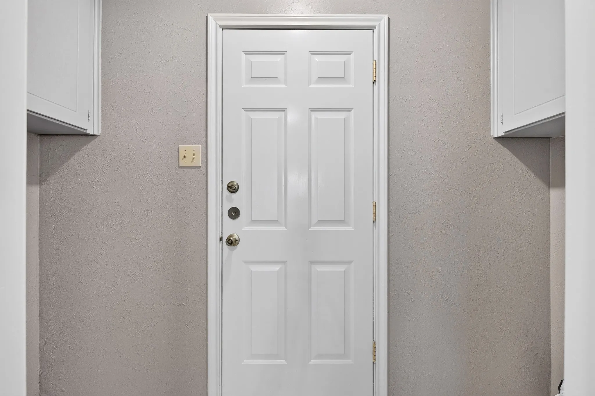 White paneled door with three-point locking system