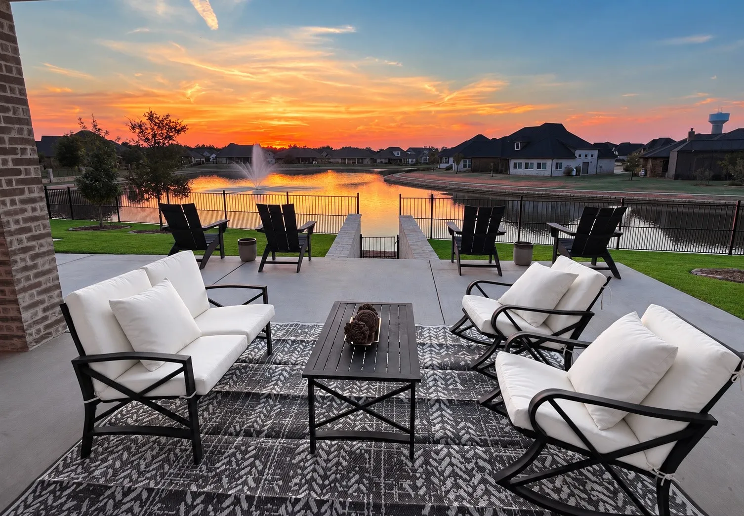 Spacious concrete patio with brick column detail