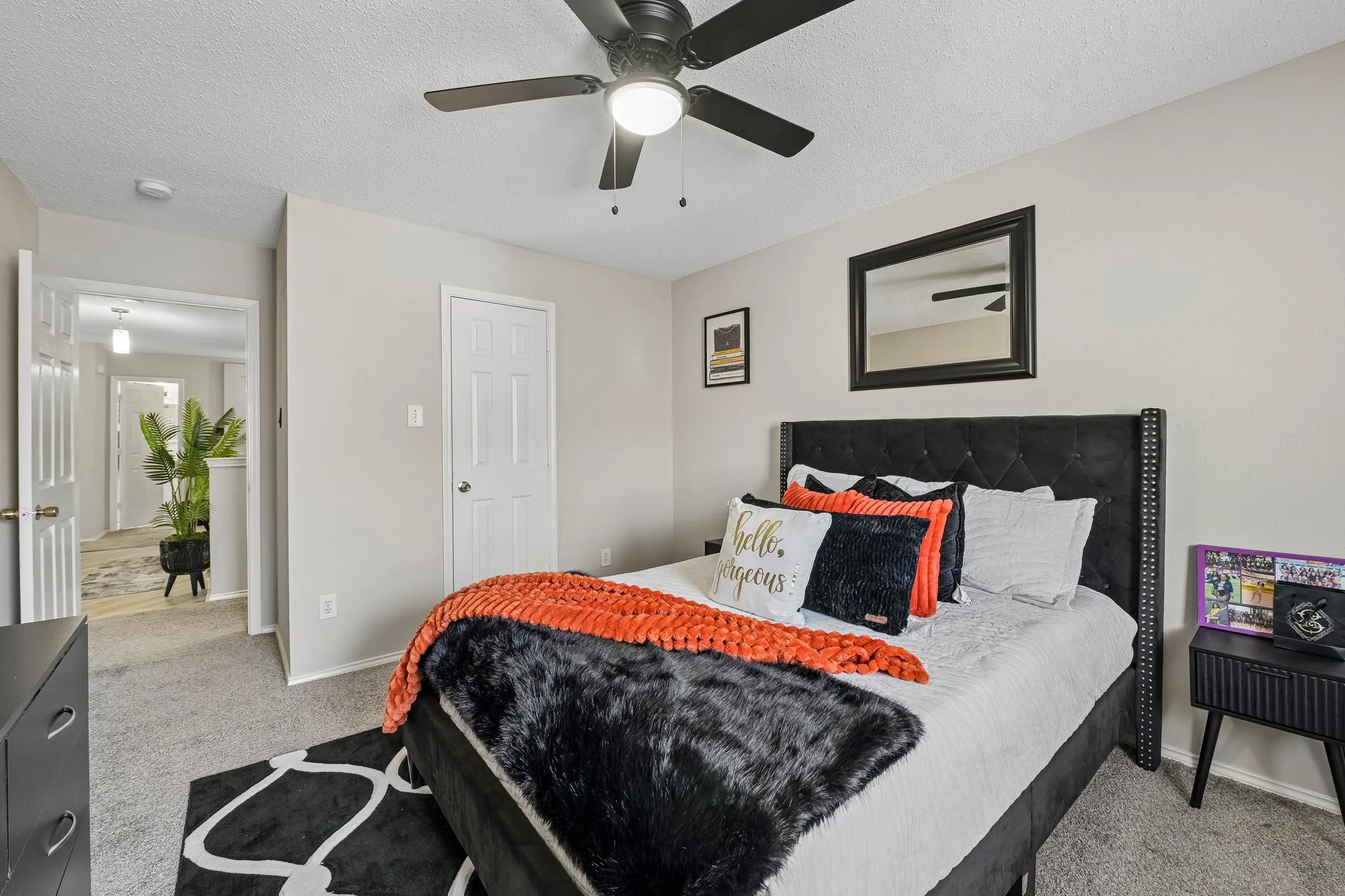 Neutral-toned walls complement the carpeted flooring