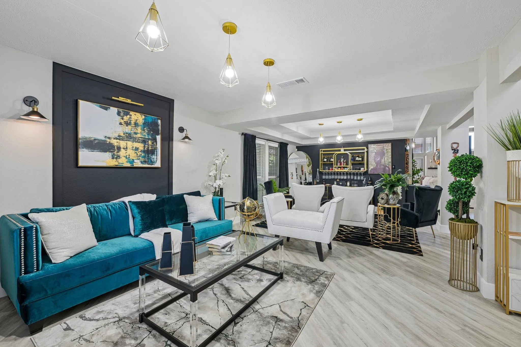 Spacious interior with light wood-finish flooring, recessed lighting, and a tray ceiling