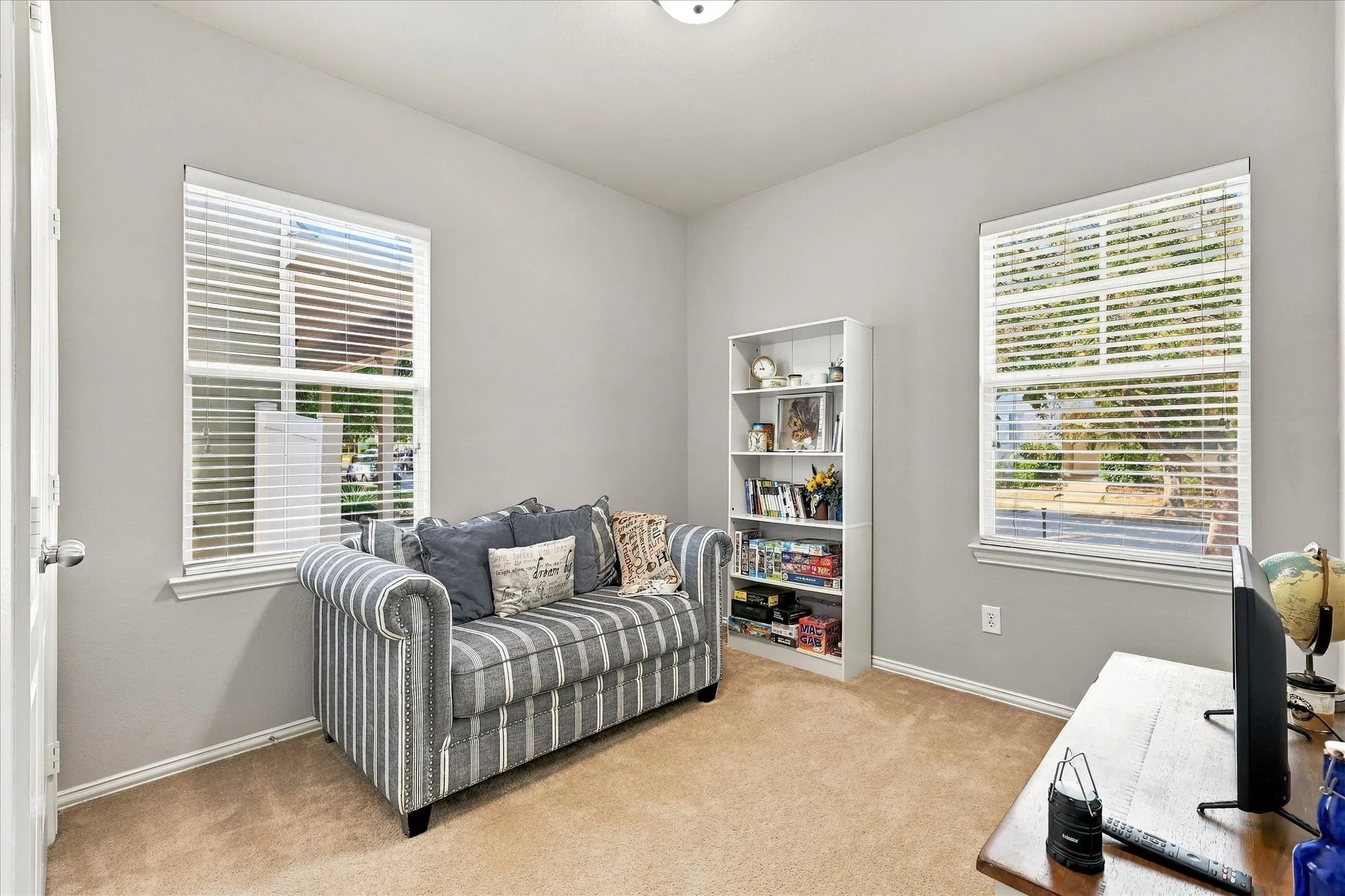 Additional bedroom on first level with split bath and natural light.