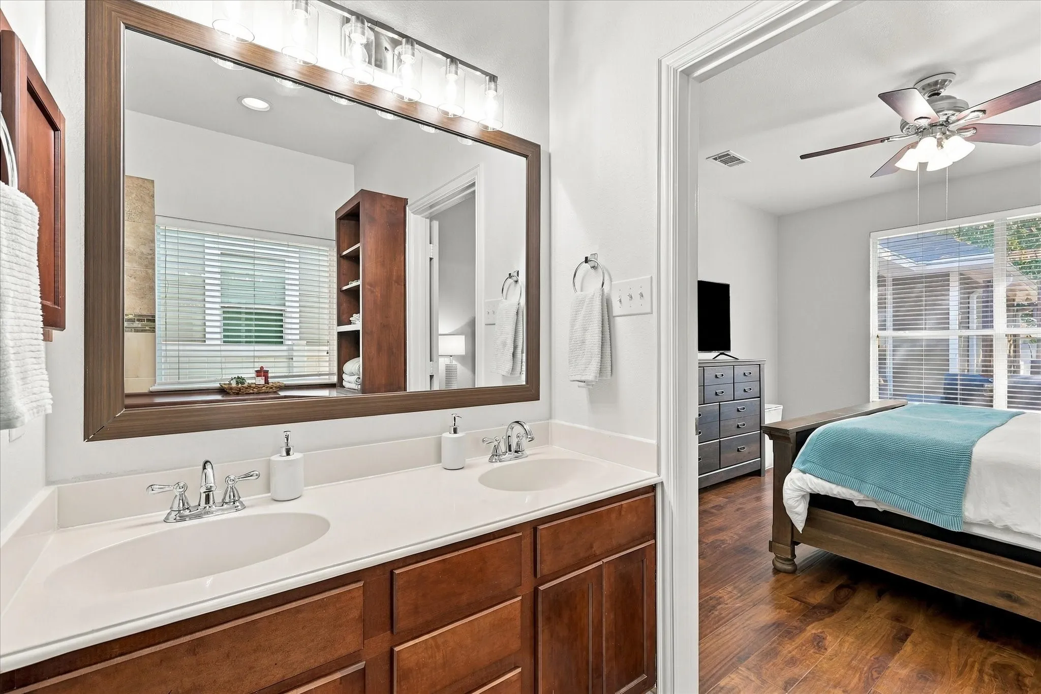 Updated mirror and lighting with built ins, large walk in shower and walk in closet.