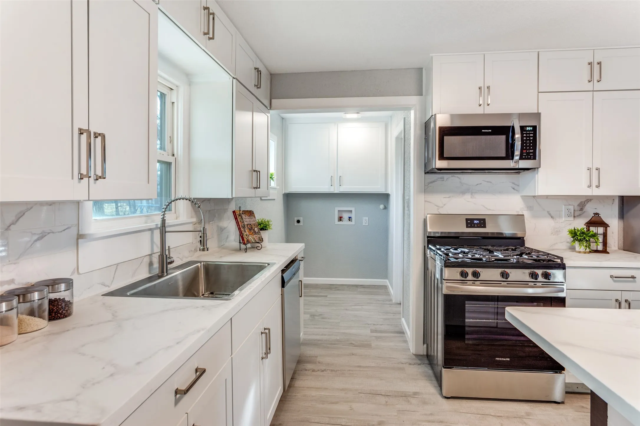 Laundry room off kitchen and master bedroom closet
