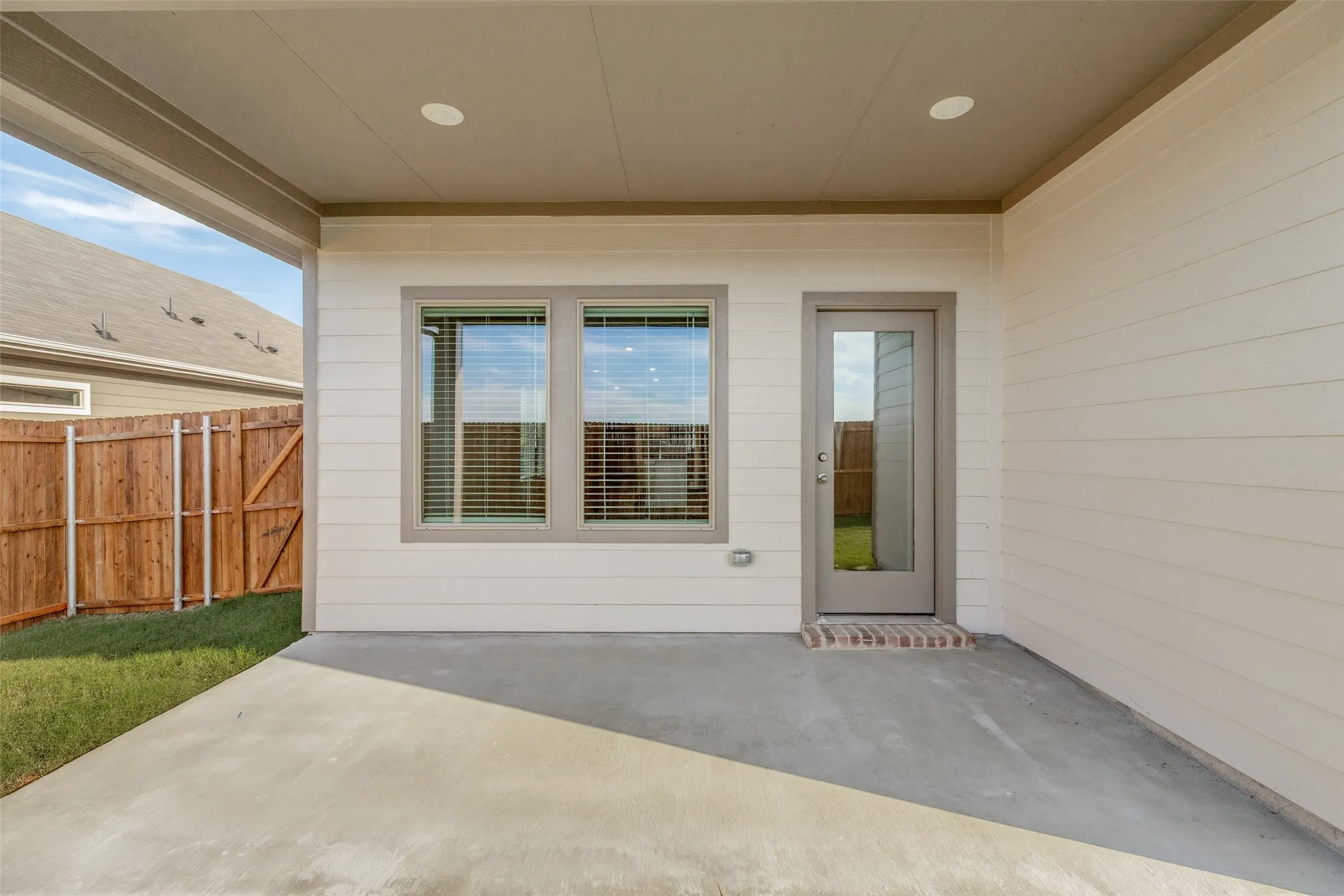 Your Own Covered Outdoor Retreat! - Step outside to a spacious covered patio featuring recessed lighting and direct access from the family room. Whether enjoying your morning coffee, dining outdoors, or relaxing after a long day, this inviting space extends your living area into the fresh air.