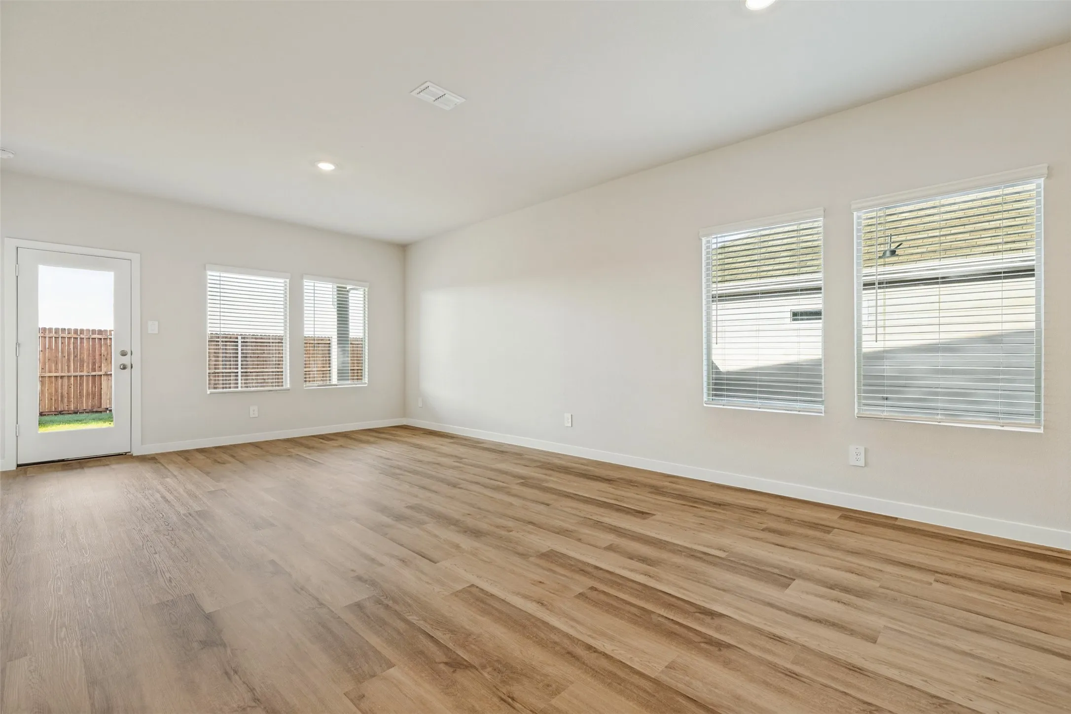 Natural Light Makes All the Difference! - Multiple windows brighten the open living and dining spaces, while included window blinds provide added convenience. Easy access to the covered back patio extends your living experience outdoors.