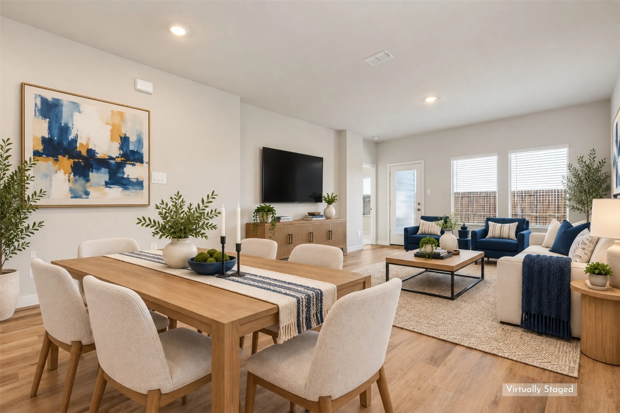 Designed for Gathering & Everyday Living! - The open-concept dining and family rooms create an inviting space for everything from casual meals to entertaining guests. Executive vinyl plank flooring, abundant natural light, and easy access to the covered patio make this layout as practical as it is welcoming.