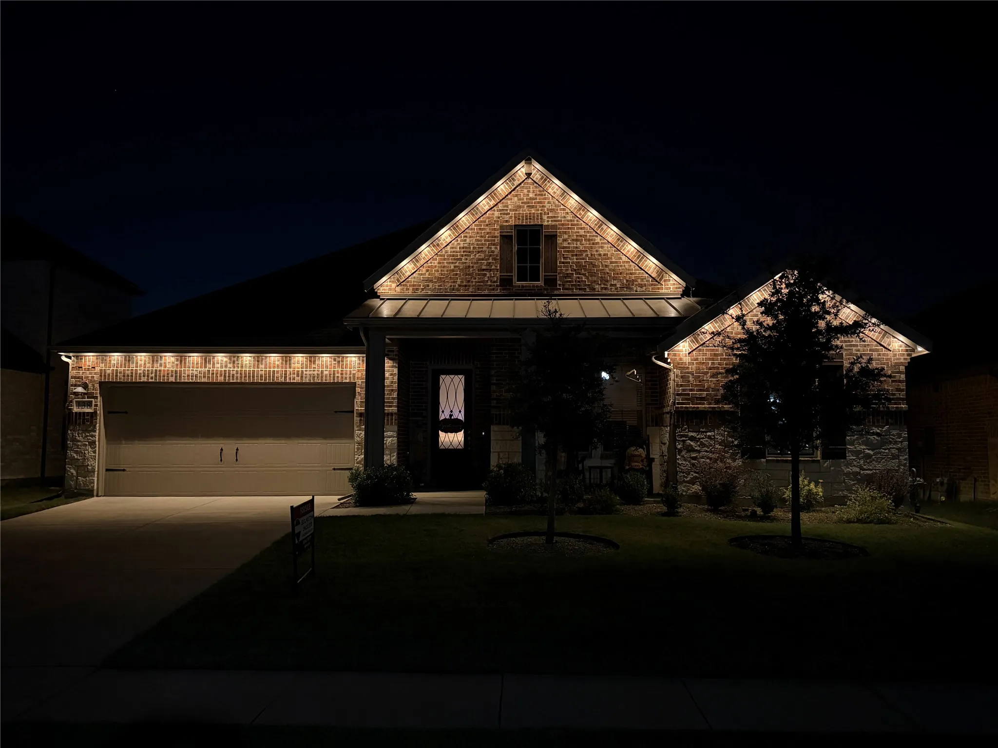 Lights change color to your desire. ALso has a stone elevation & covered front porch.