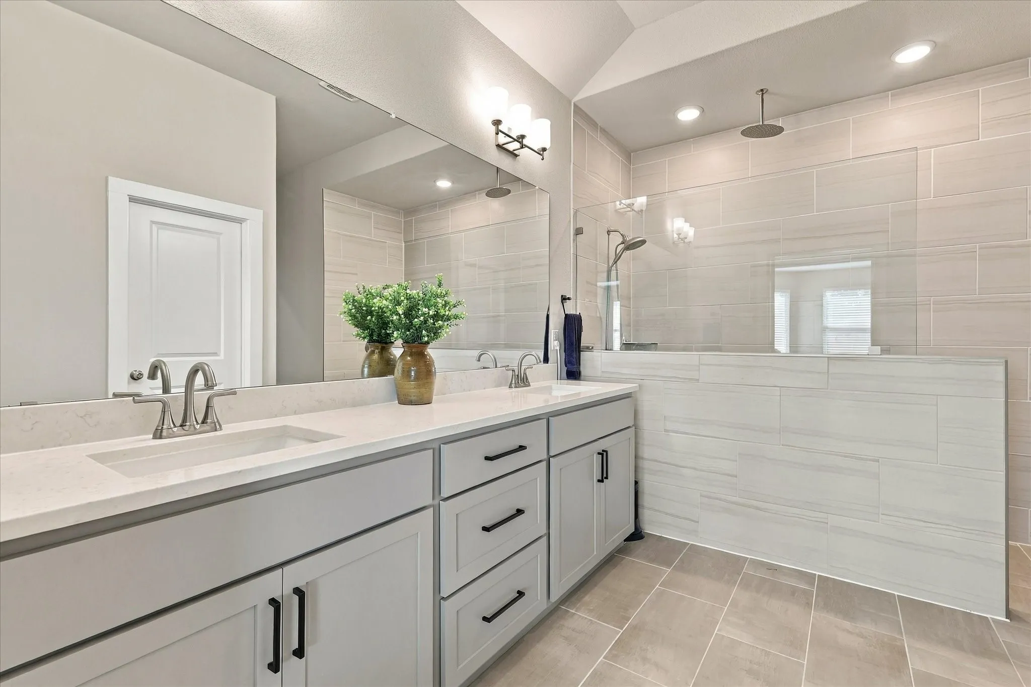Ensuite has quartz top, dual sinks & an extra elongated walk-in shower with rain shower & 2nd head.