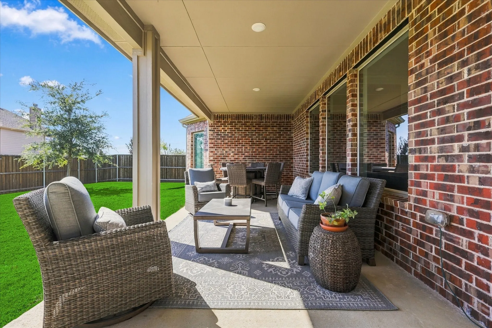 33 X 10 extra long covered patio for more outdoor enjoyment. Outdoor furniture will stay with a full price offer if you want it.