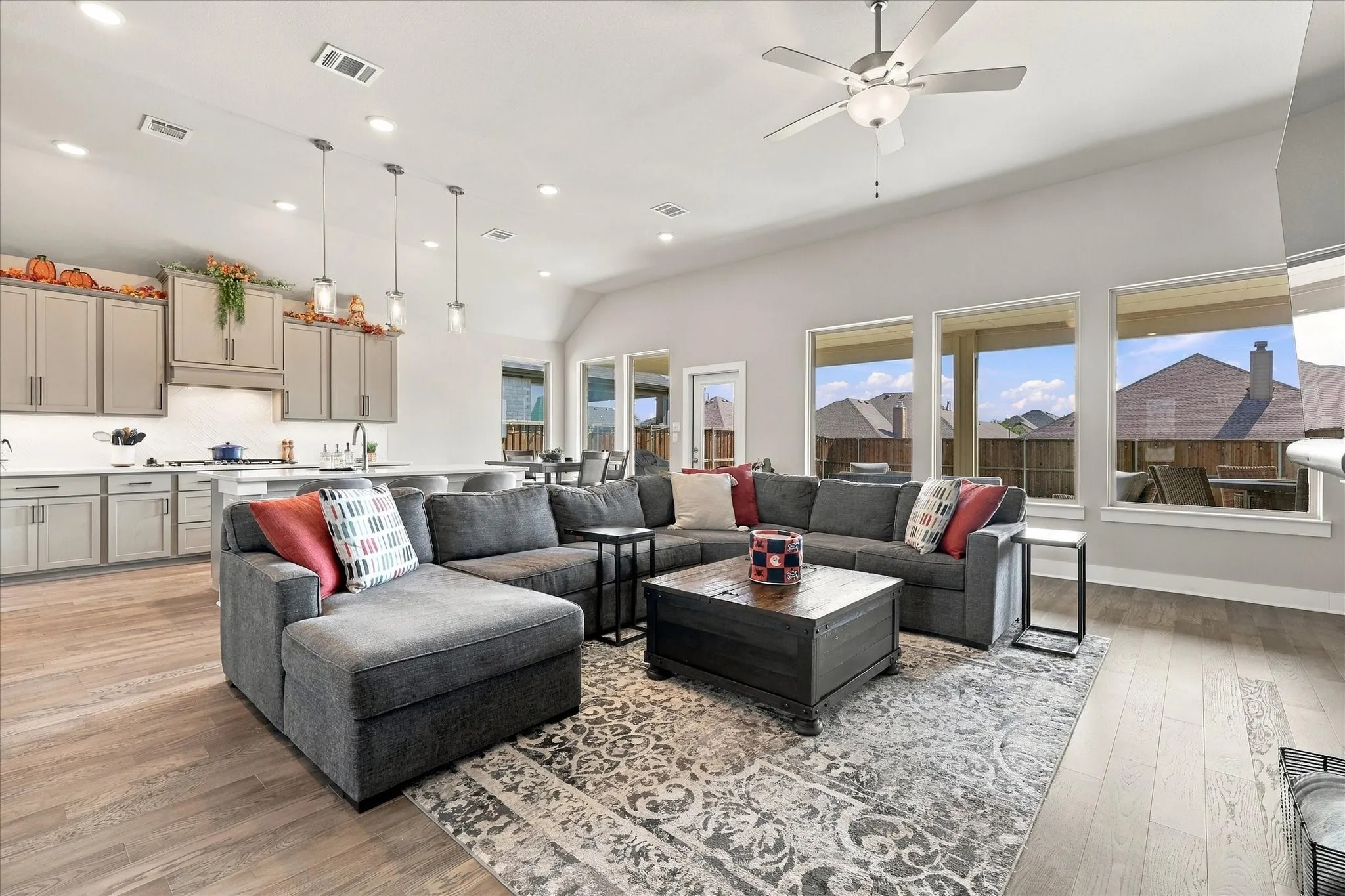 Sweeping open & light plan with wall of windows to the back yard & high ceilings.