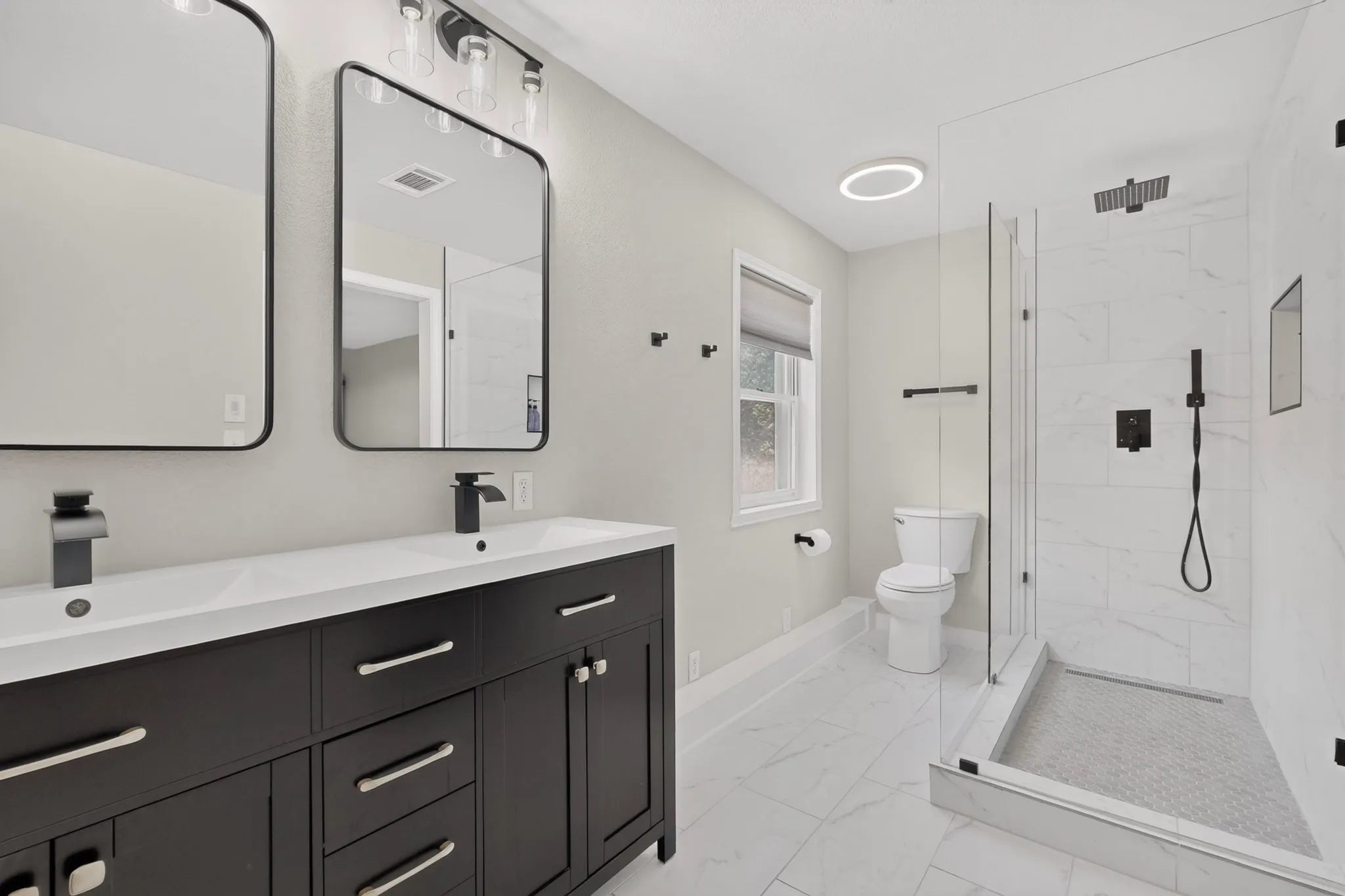 Primary Bathroom with Dual Vanities and Walk in Shower