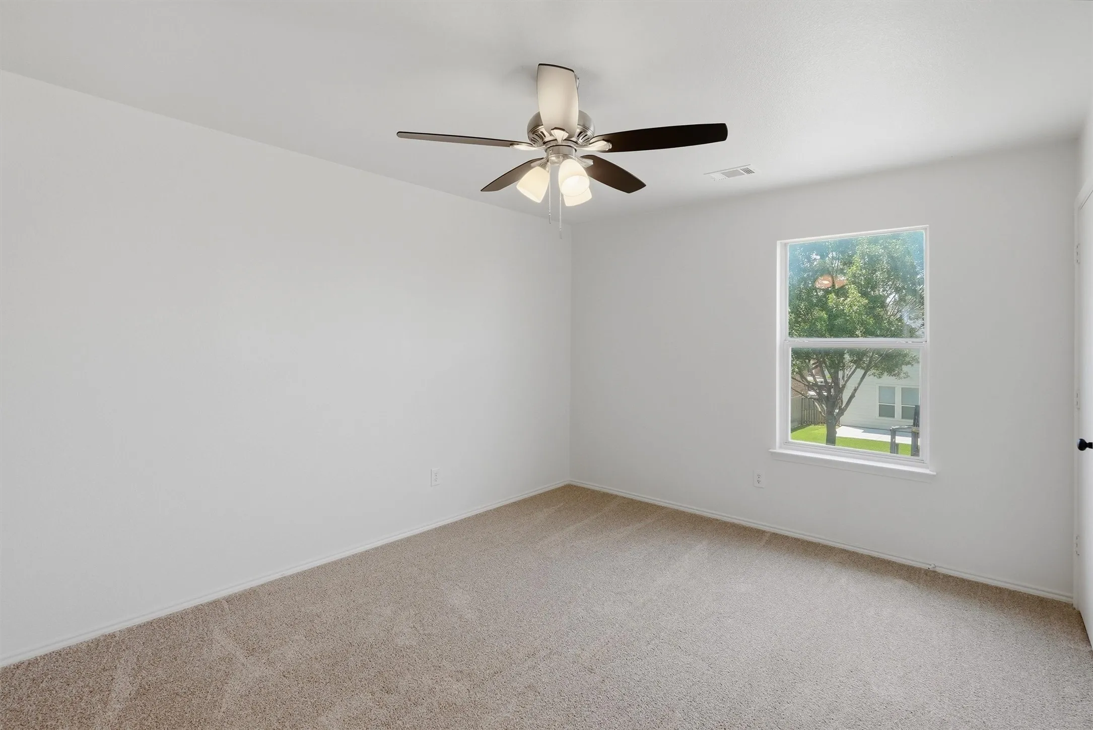 Neutral tone carpeting with white walls and trim