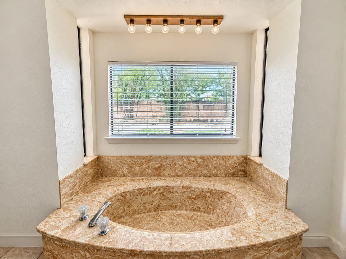 Built-in soaking tub with a patterned surround