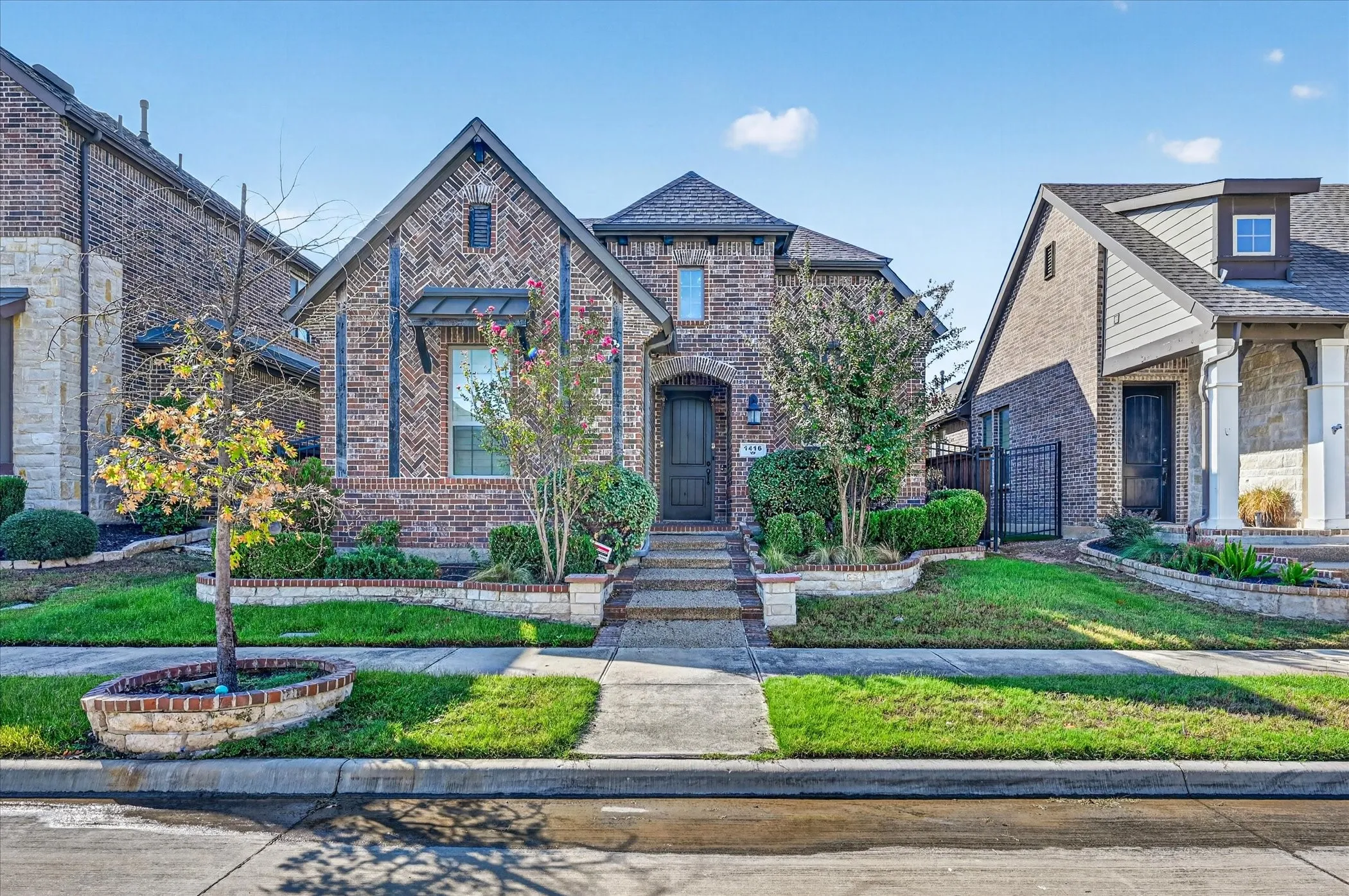 Brick exterior with stone accents and dark trim