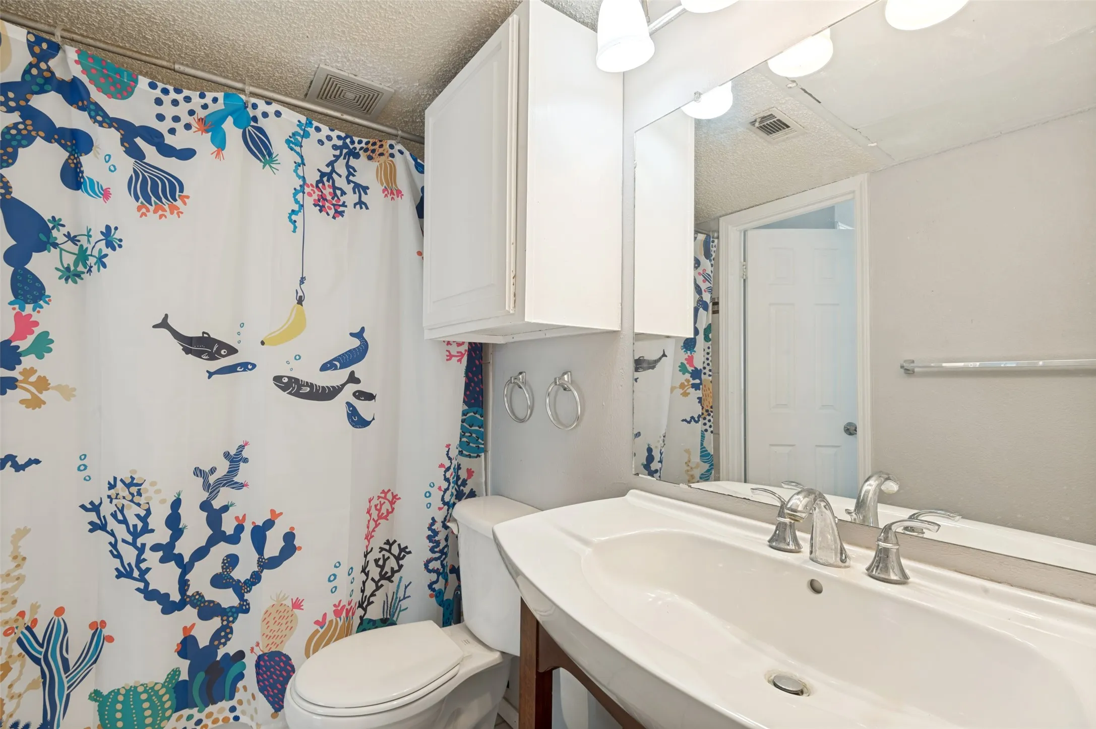 Vanity with an integrated sink and chrome faucet