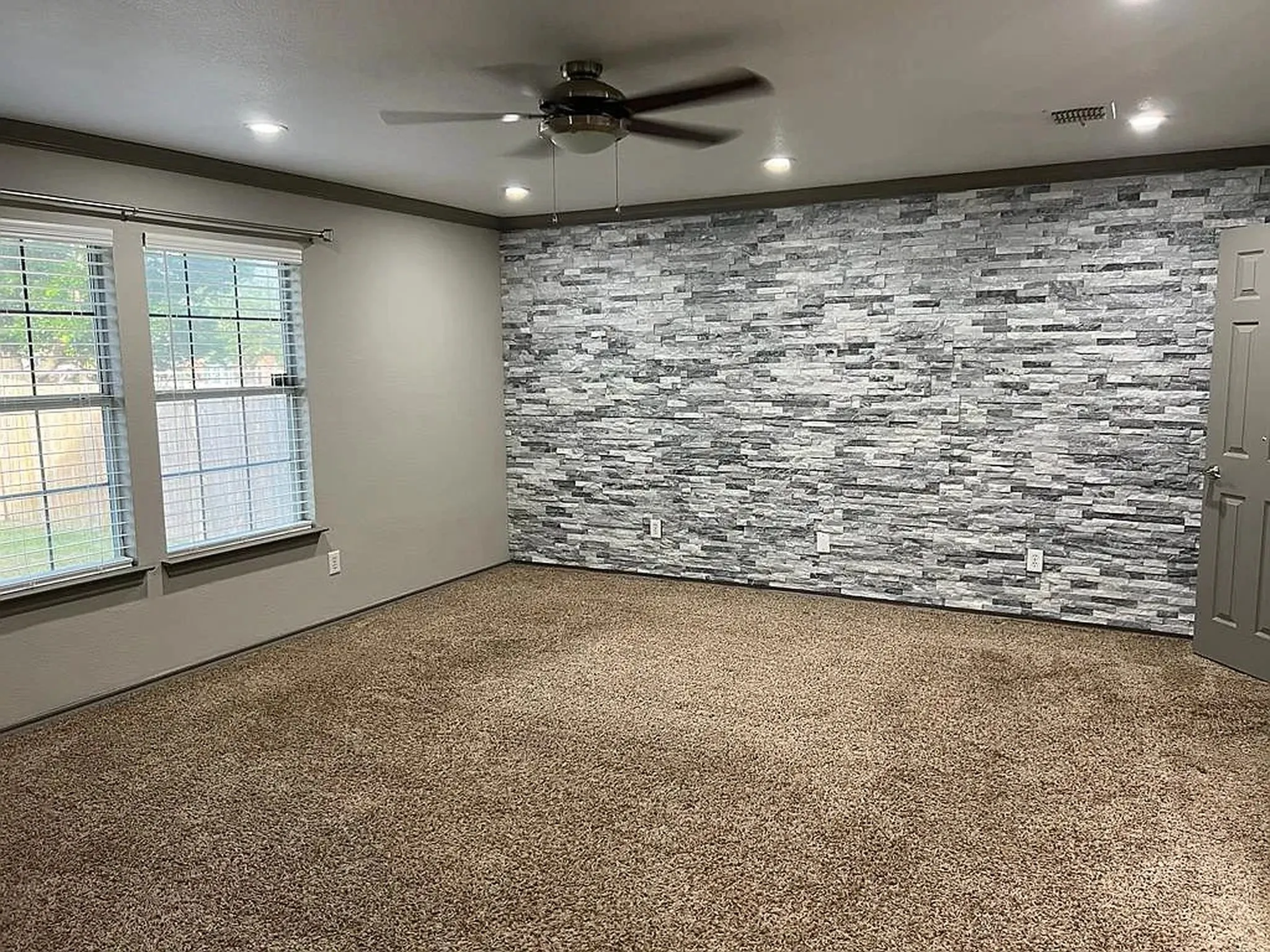 Recessed lighting and ceiling fan overhead