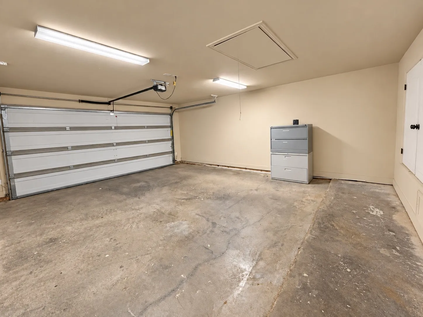 Attached overhead garage door with opener