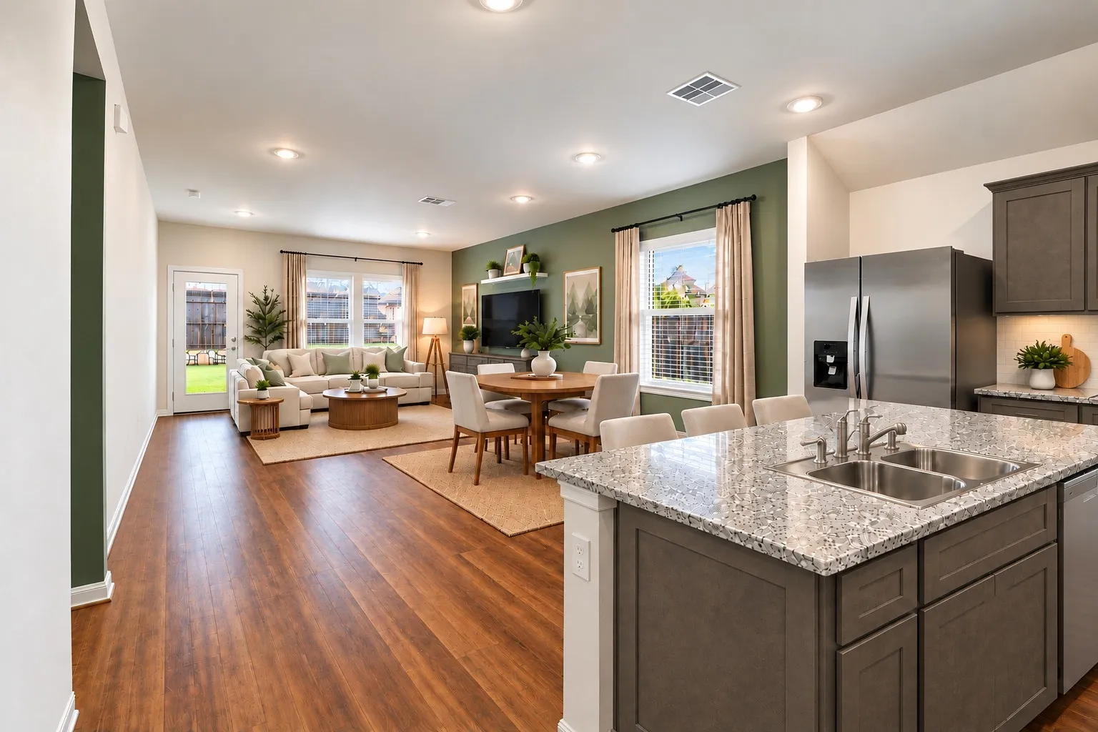 Virtually staged kitchen, dining, and living areas