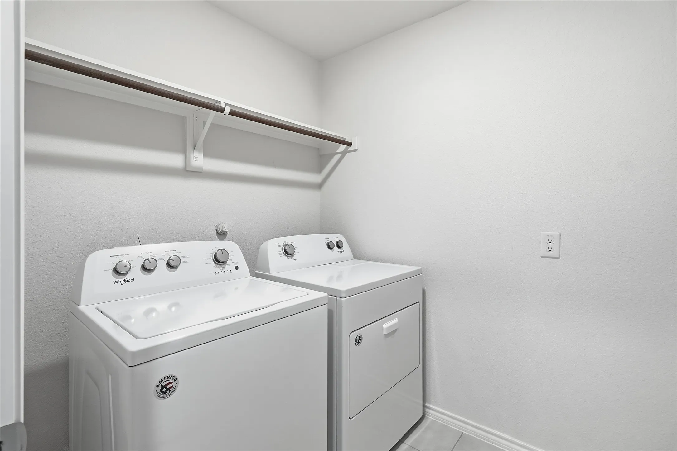 Separate utility room with drying rack