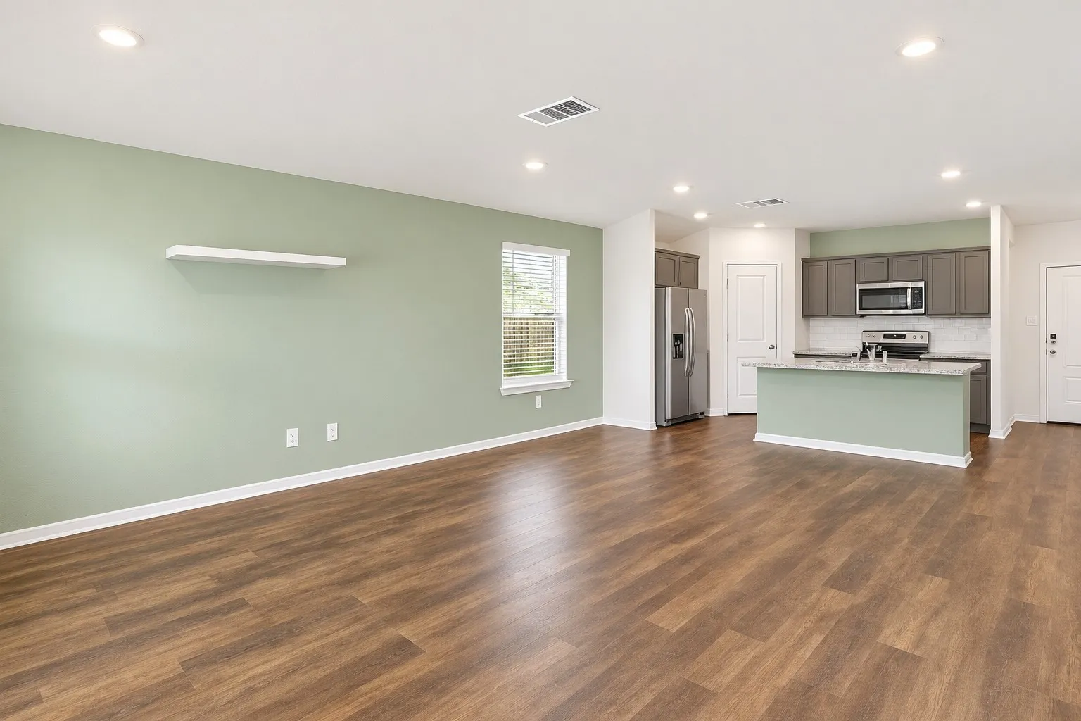 Large open floorplan featuring the living and dining areas and the kitchen
