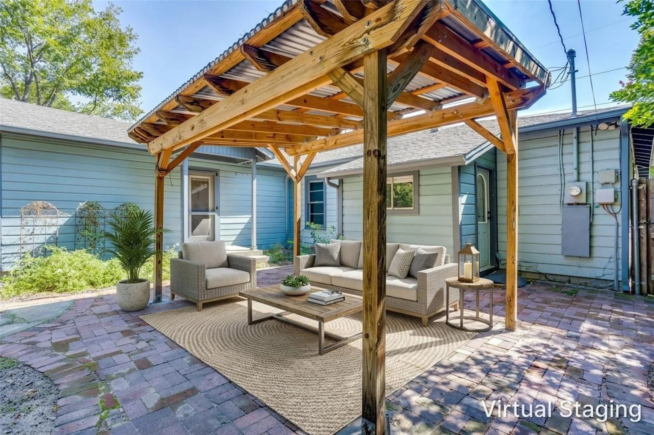 Covered pergola over a brick patio