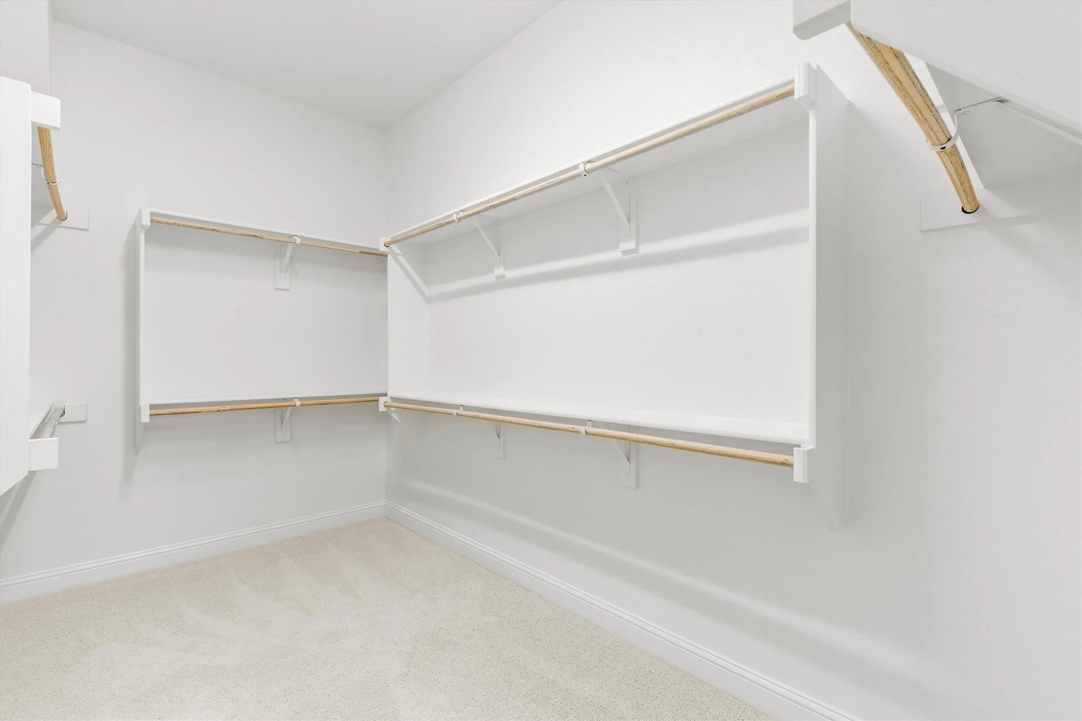 Primary bedroom has two separate, large walk in closets
