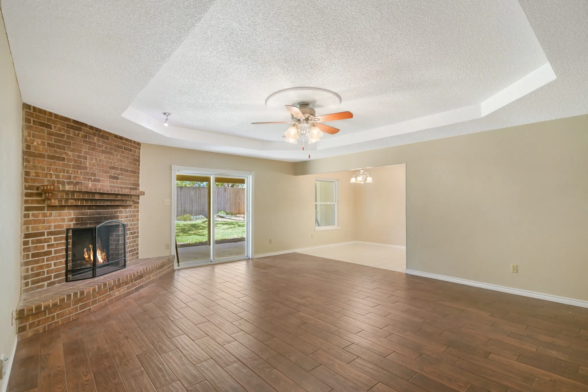 Spacious living room with cozy fireplace.