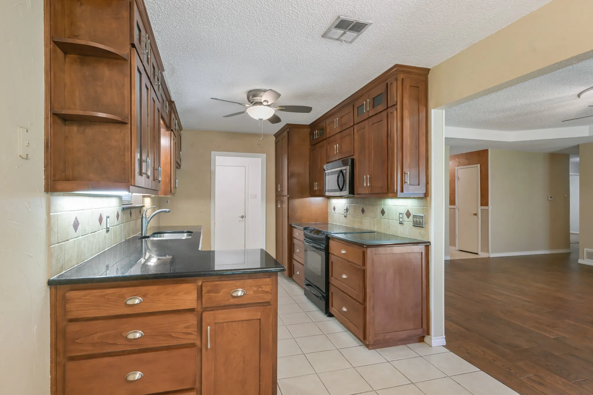 Notice the beautiful and abundant cabinetry!