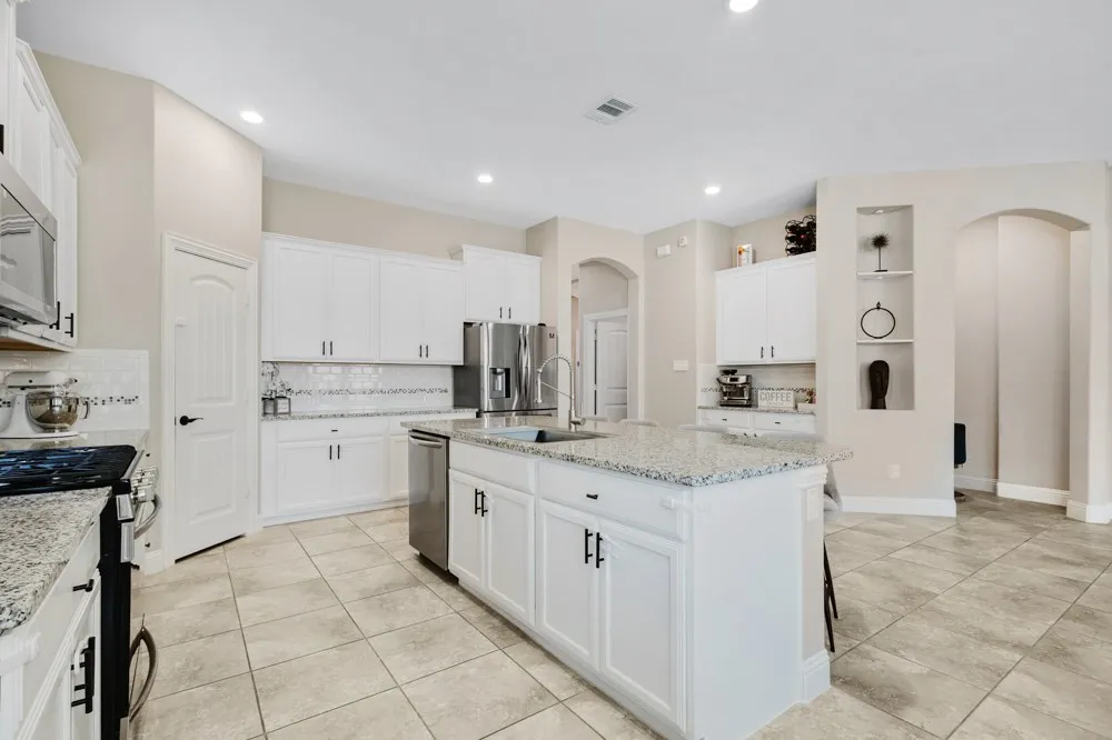 Kitchen featuring tons of cabinetry!  Check out the built-in hutch with coffee bar nook!