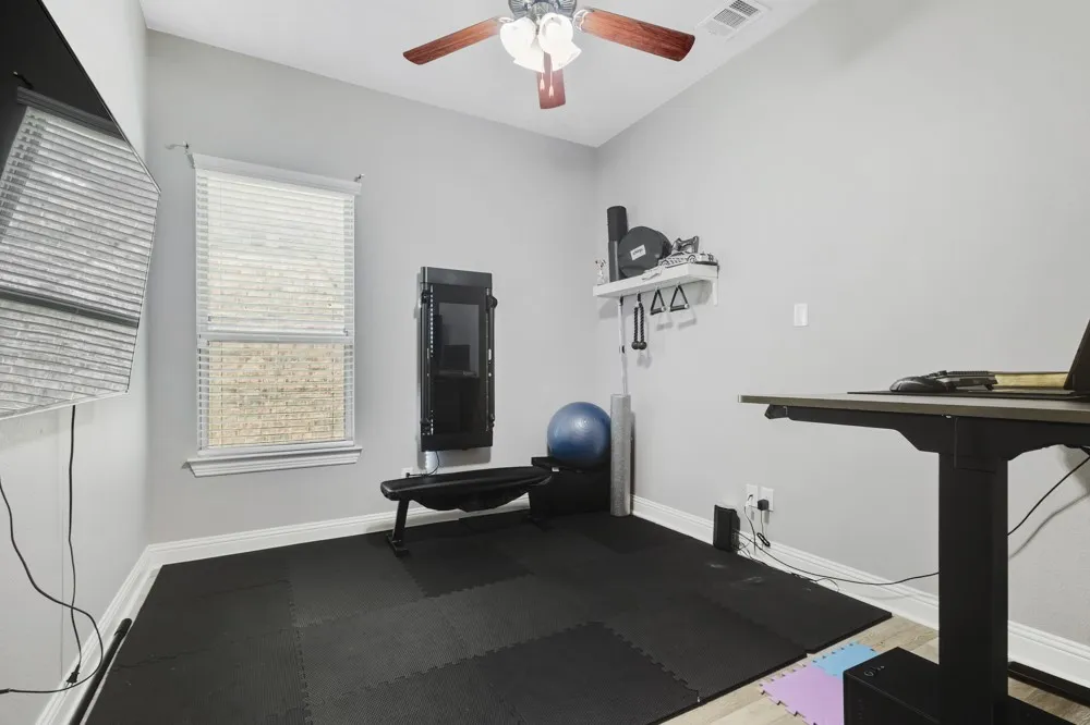 French doors lead into the study or flex space split from the bedrooms for additional privacy.