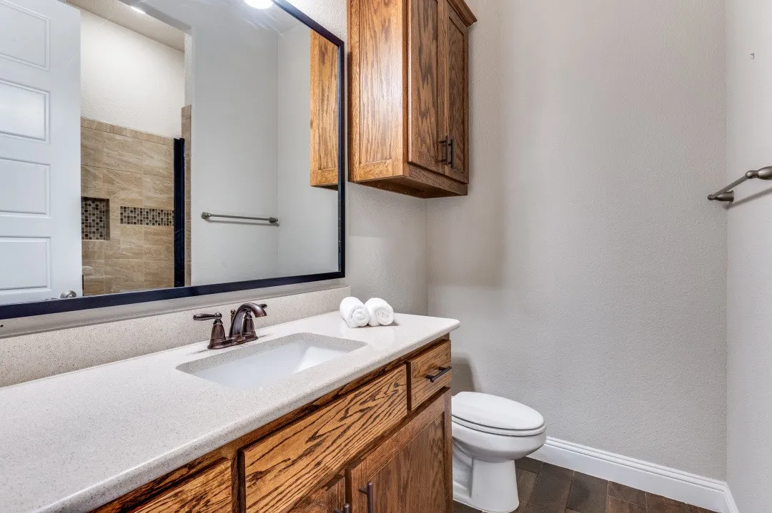 Seconndary bath w large walk in shower off hall way & for bedroom #2.