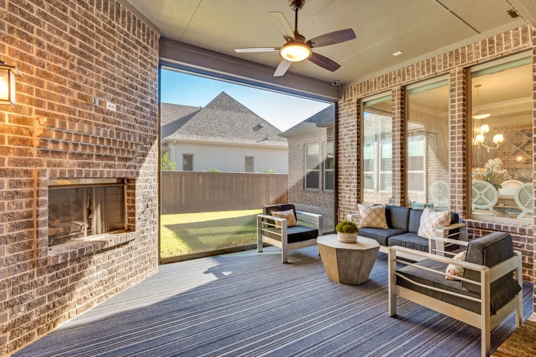 Outdoor living with remote screen & fireplace w gas logs.
