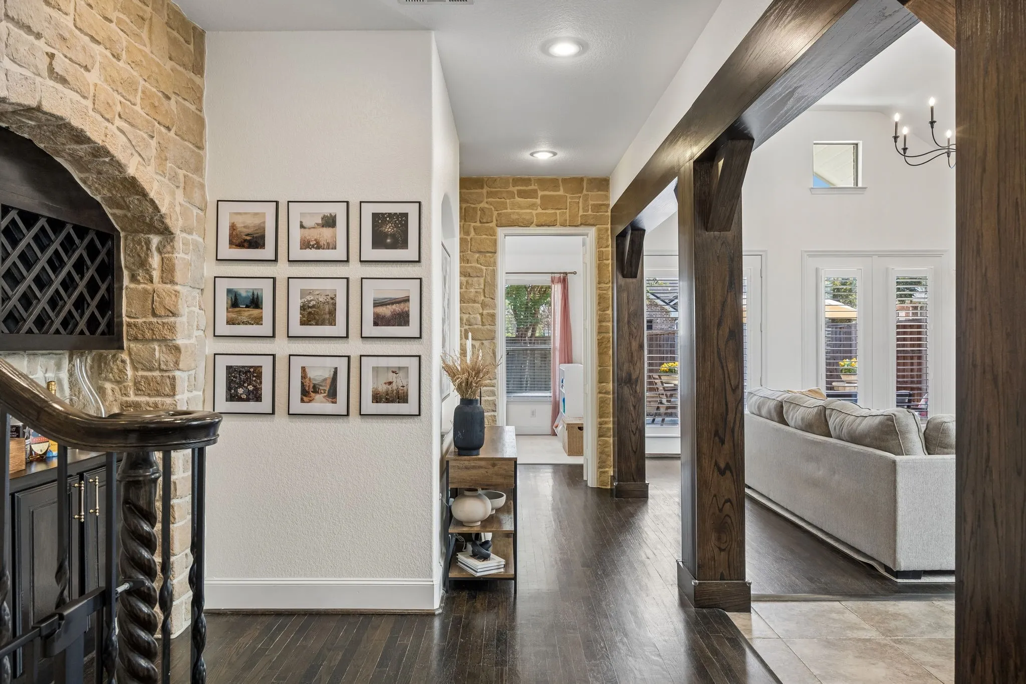 Here you can see the stone accents and the opening to the living room with dark beams