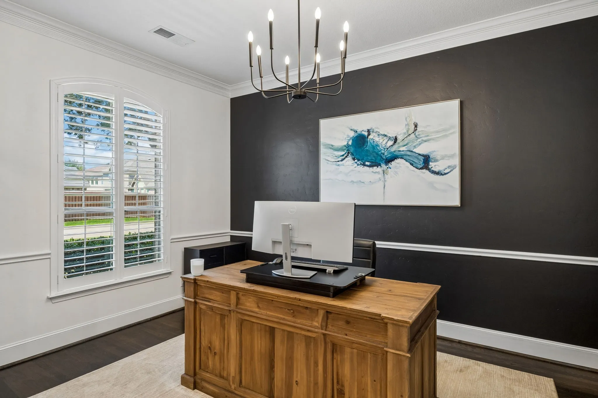 Current home office could also be additional living space or formal dining with modern chandelier