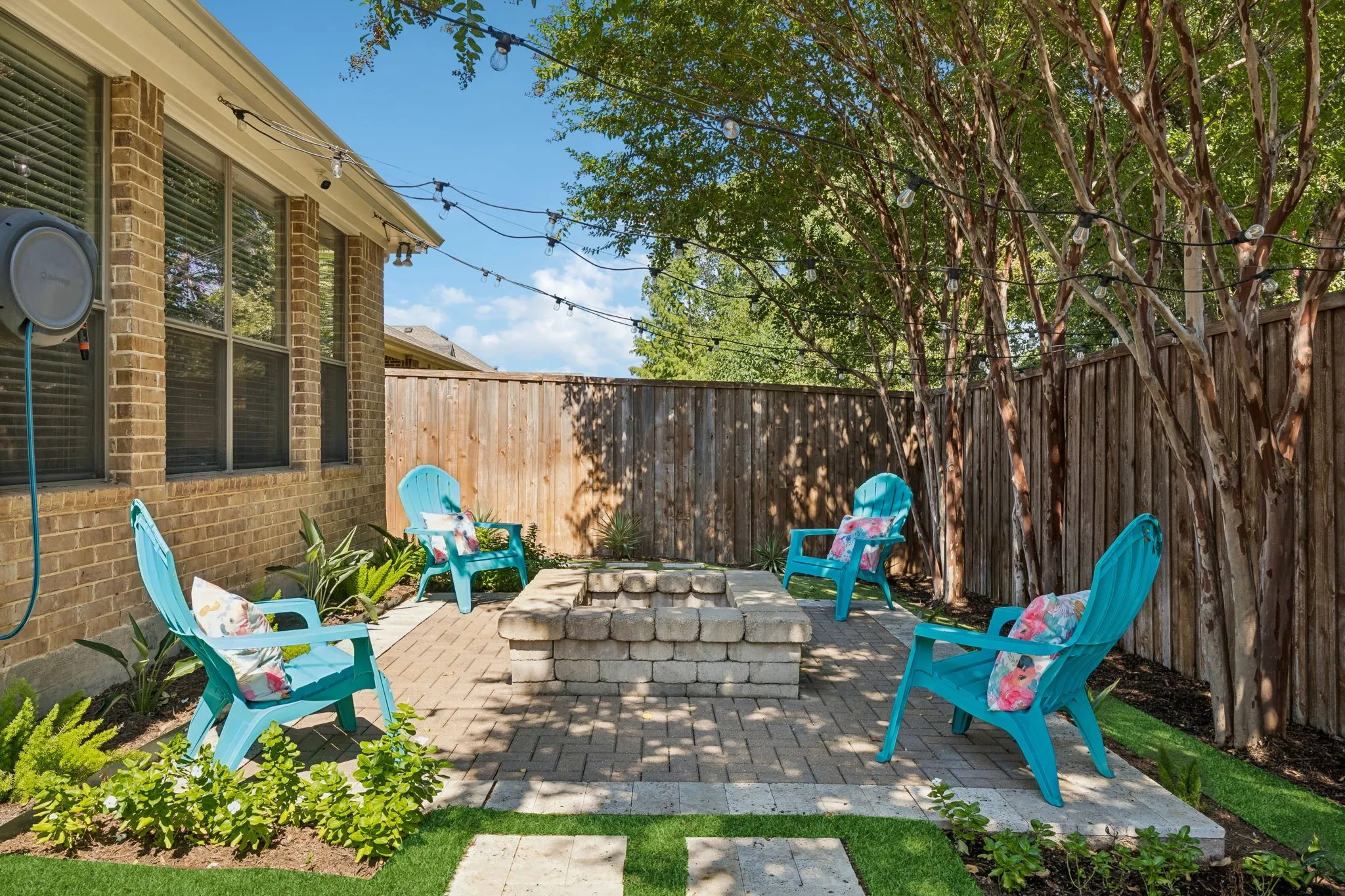 Fire pit area is perfect for entertaining or a family evening at home