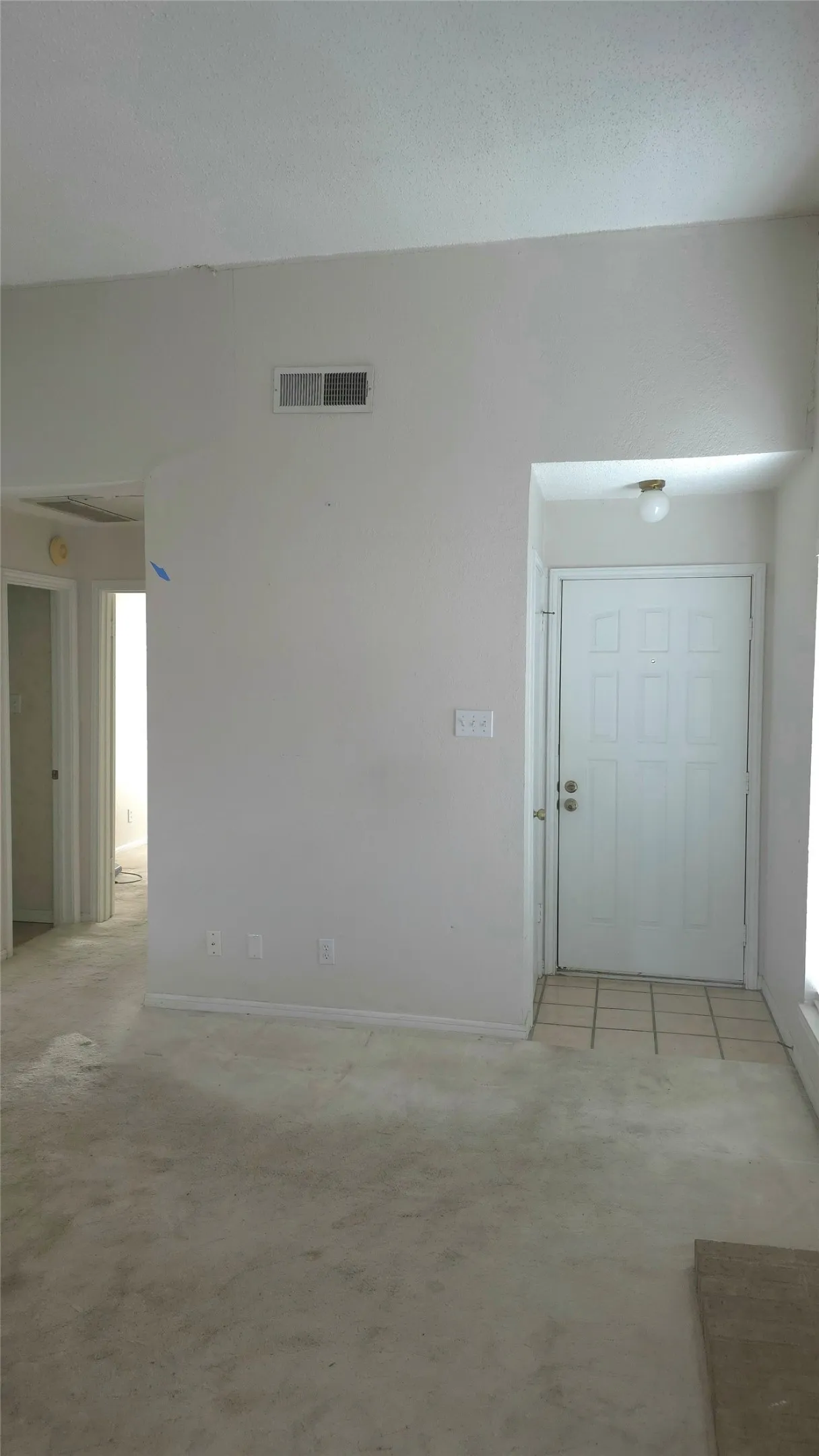 View of living to front door