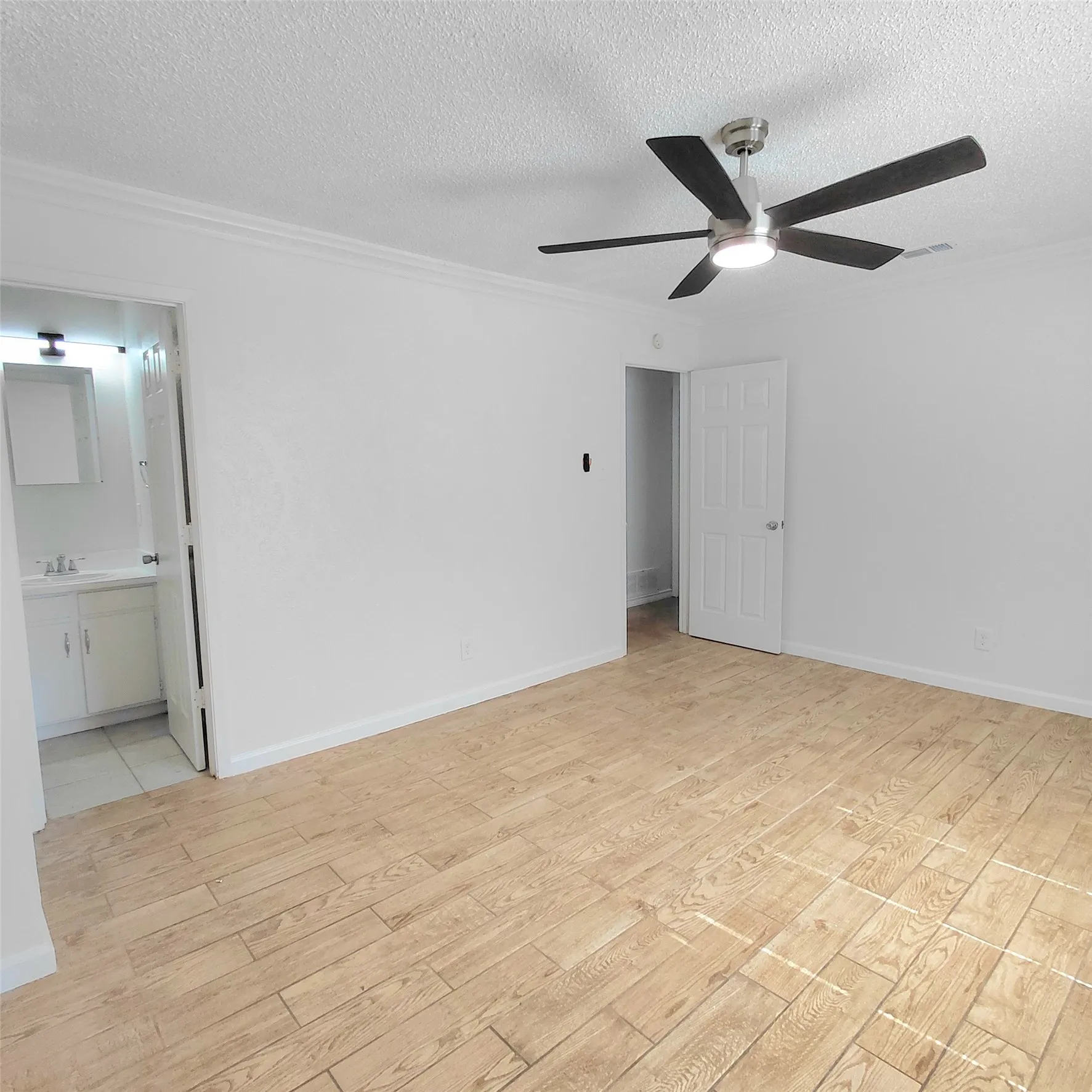 Wood-finish plank flooring throughout