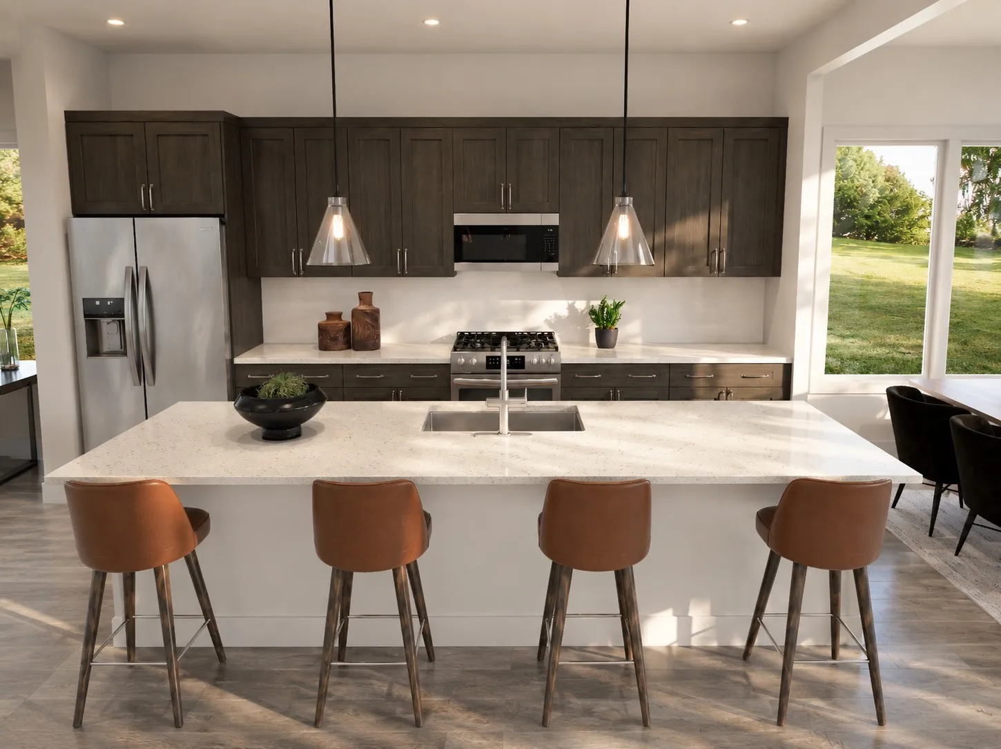 Kitchen featuring a central island with an integrated sink, dark wood-finish cabinetry, stainless steel appliances, and pendant lighting