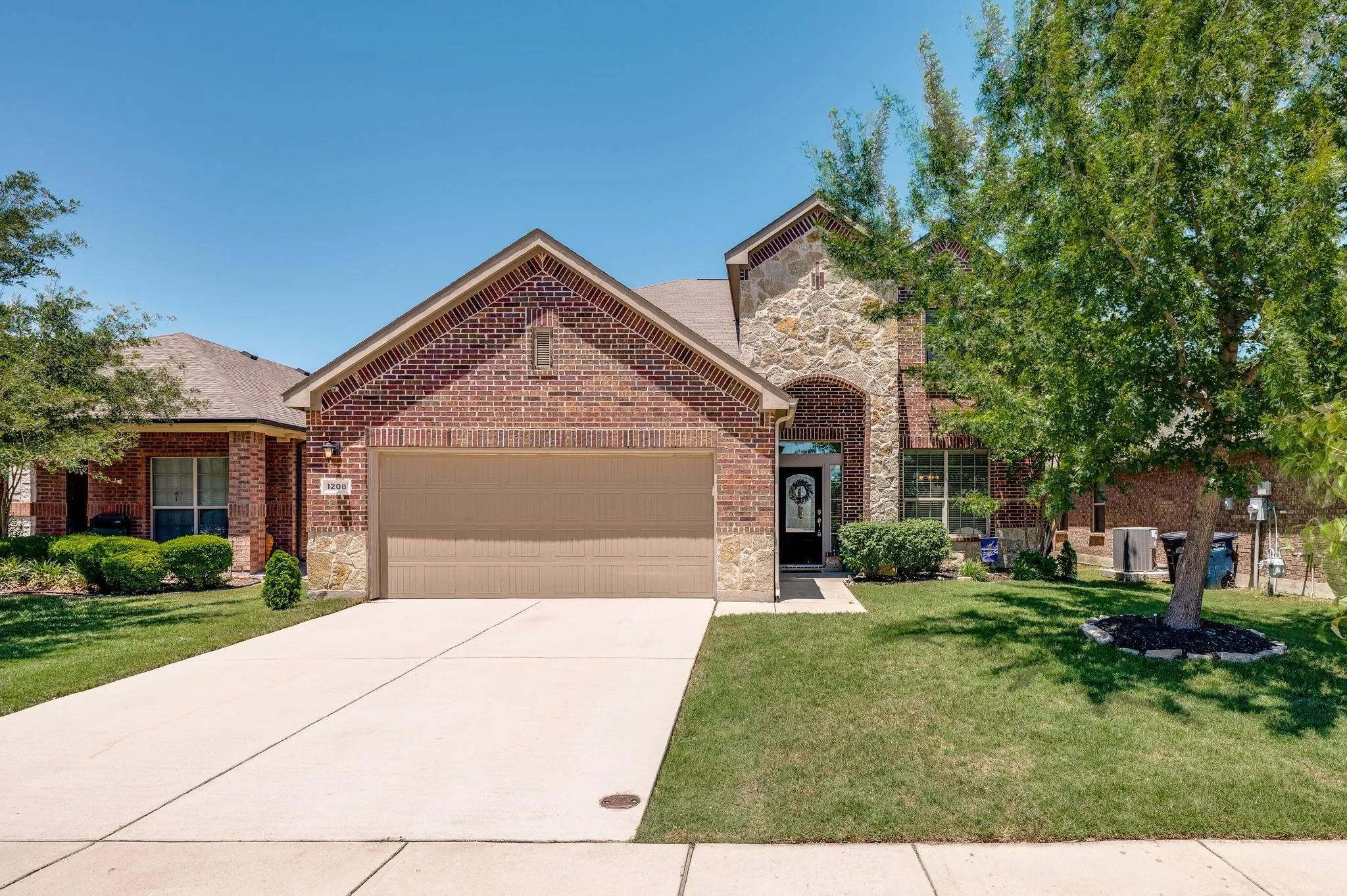 Beautifully Landscaped stone and brick façade