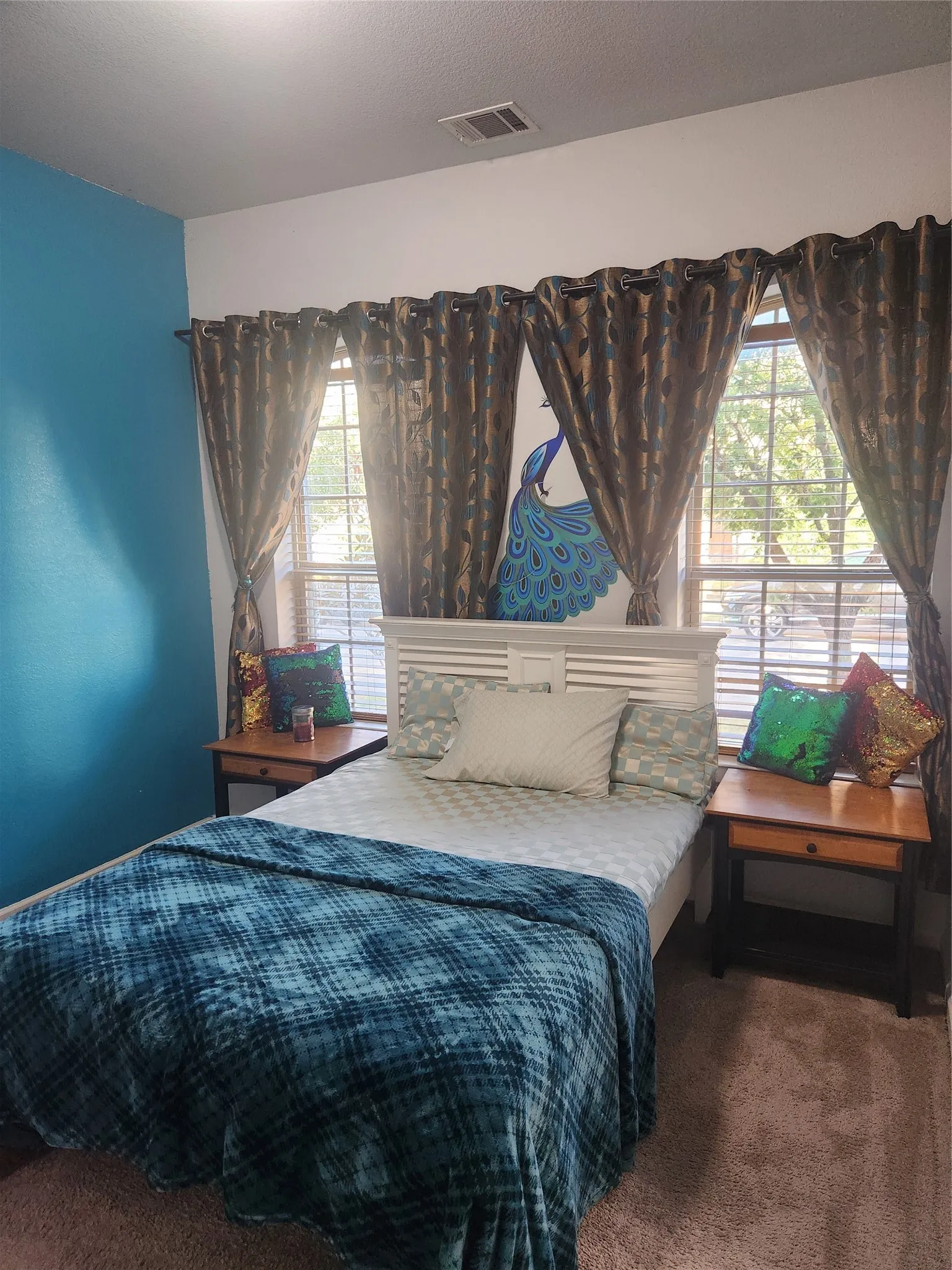 Wall-to-wall carpeting and multiple windows with blinds