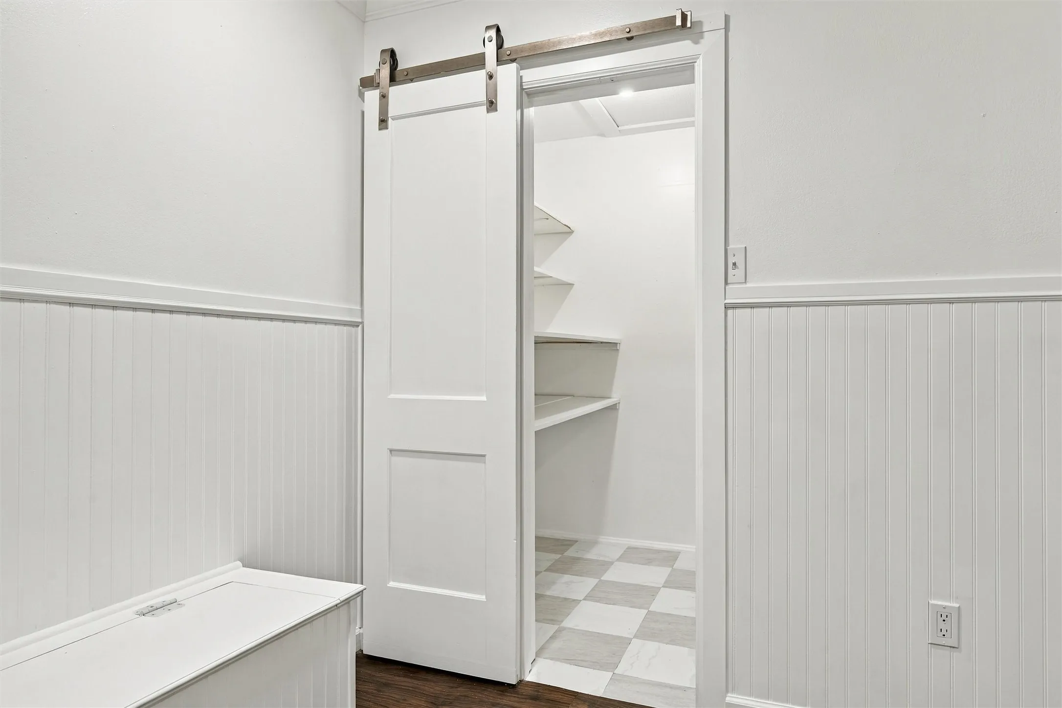 walk in pantry with custom built shelving and new flooring