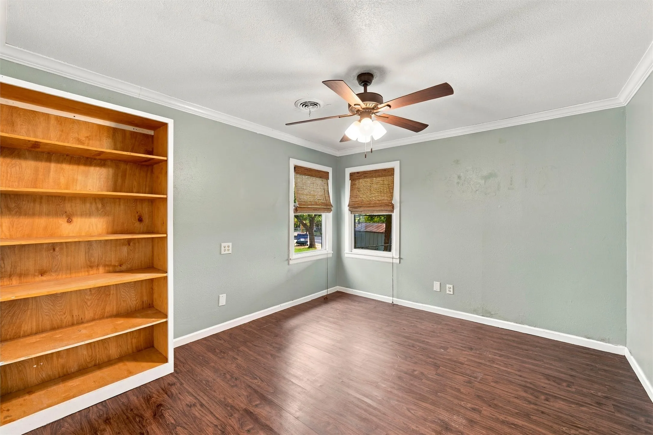 Back bedroom with custom shelving