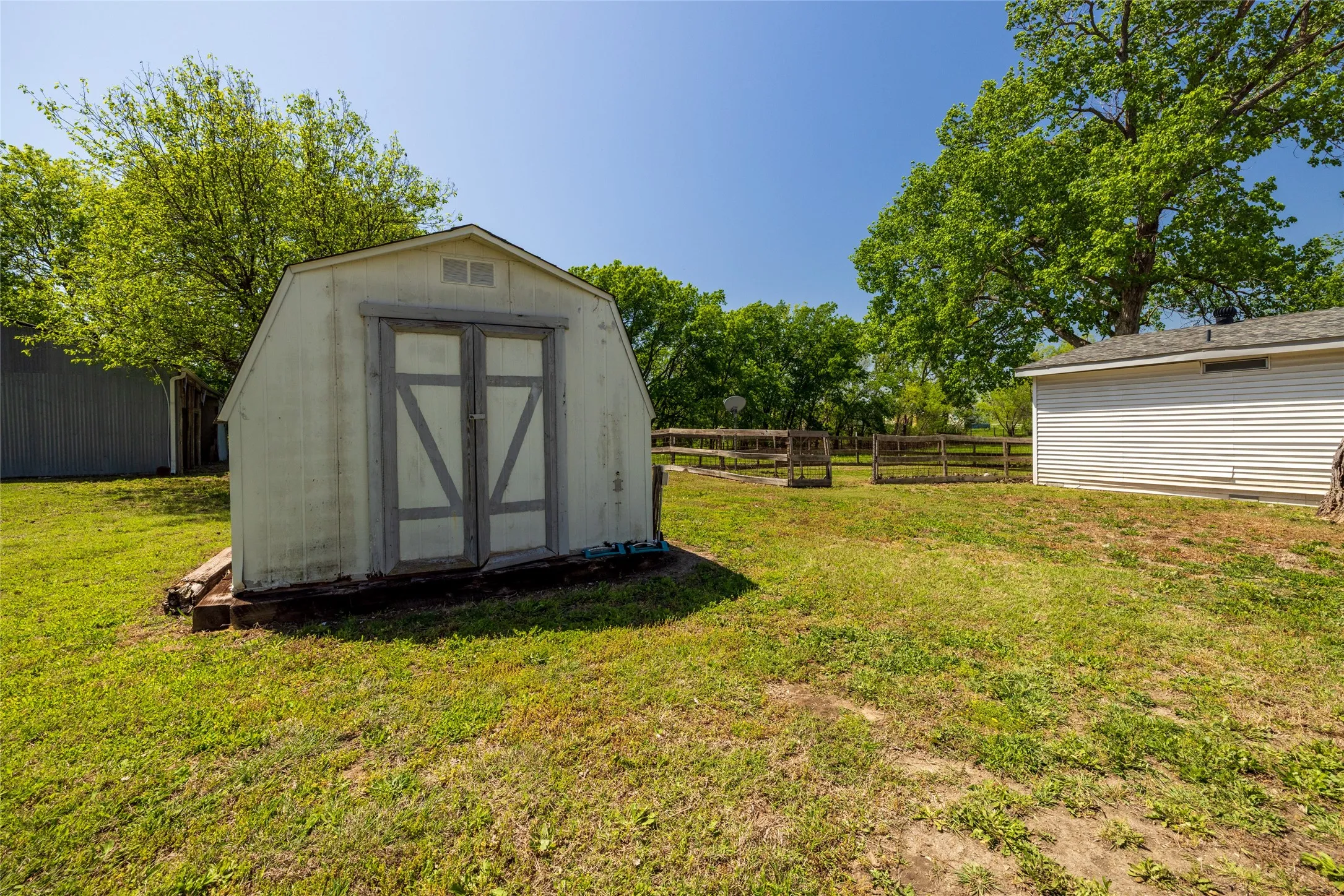 Detached storage shed with double-door entry.